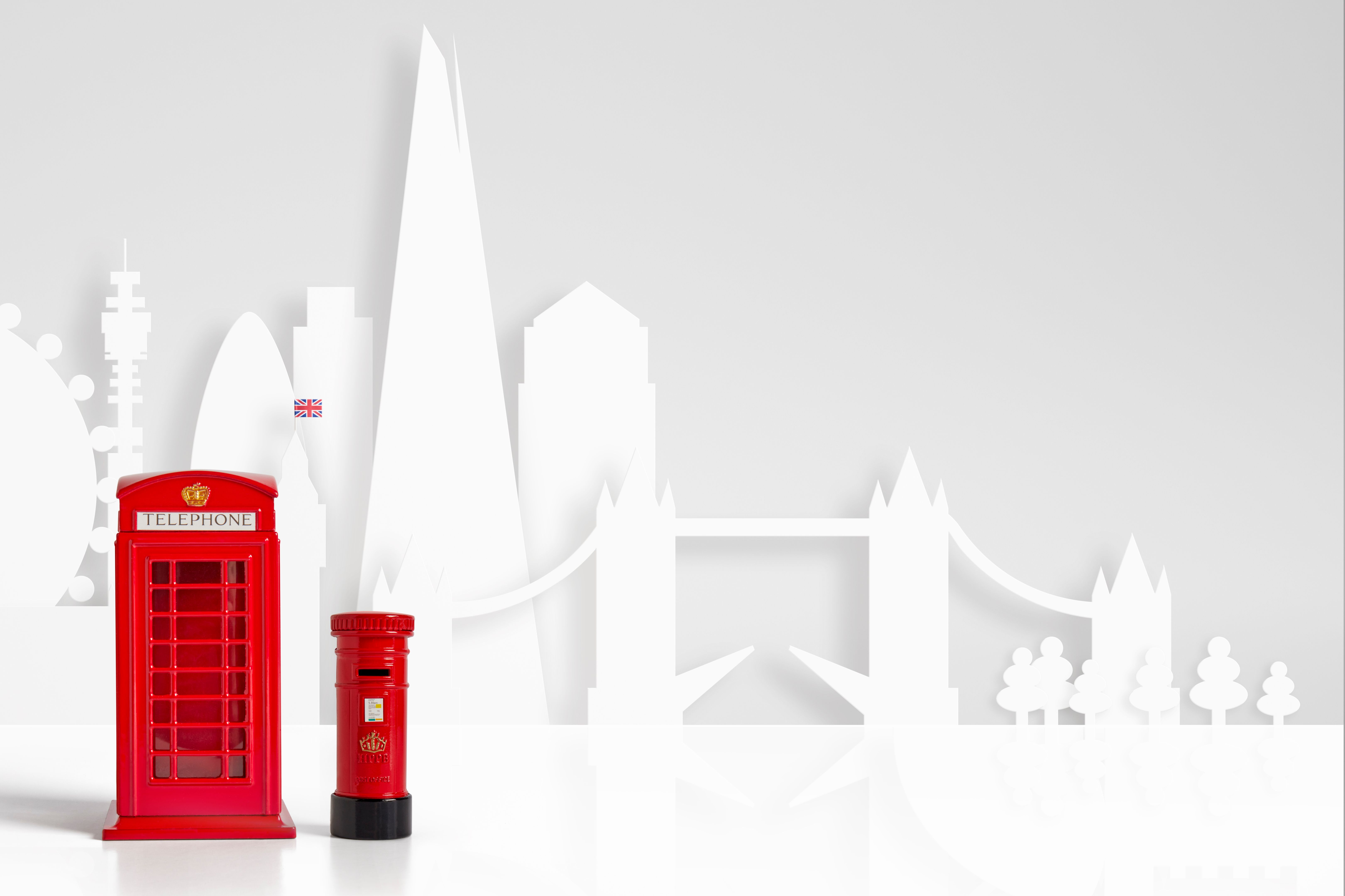 Red model telephone and post box & London skyline concept