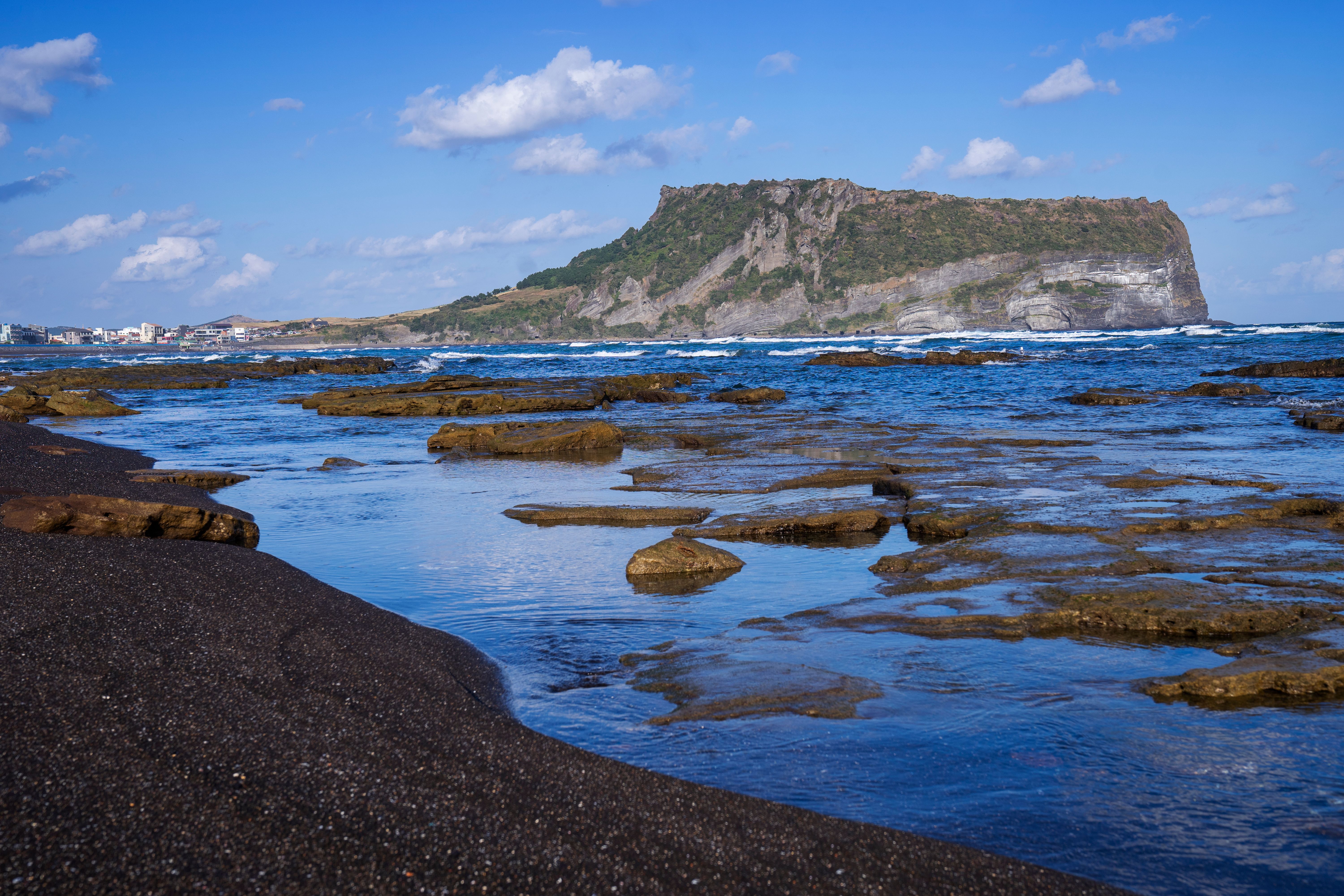 Seongsan Ilchulbong (Sunrise Peak) and Gwangchigi Beach, Jeju Island Seongsan Ilchulbong (Sunrise Peak) and Gwangchigi Beach, Jeju Island