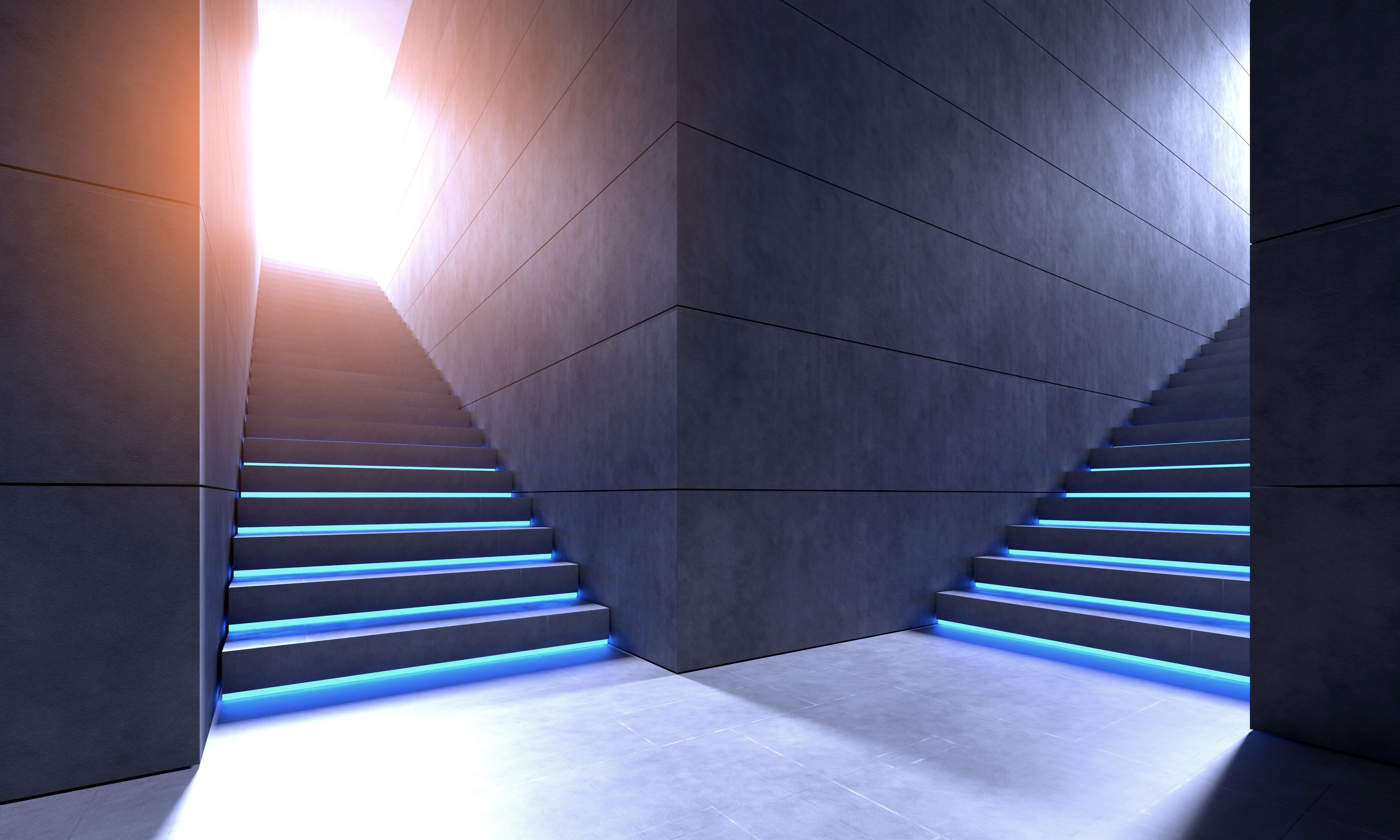 Staircases with blue neon lights climbing to exit