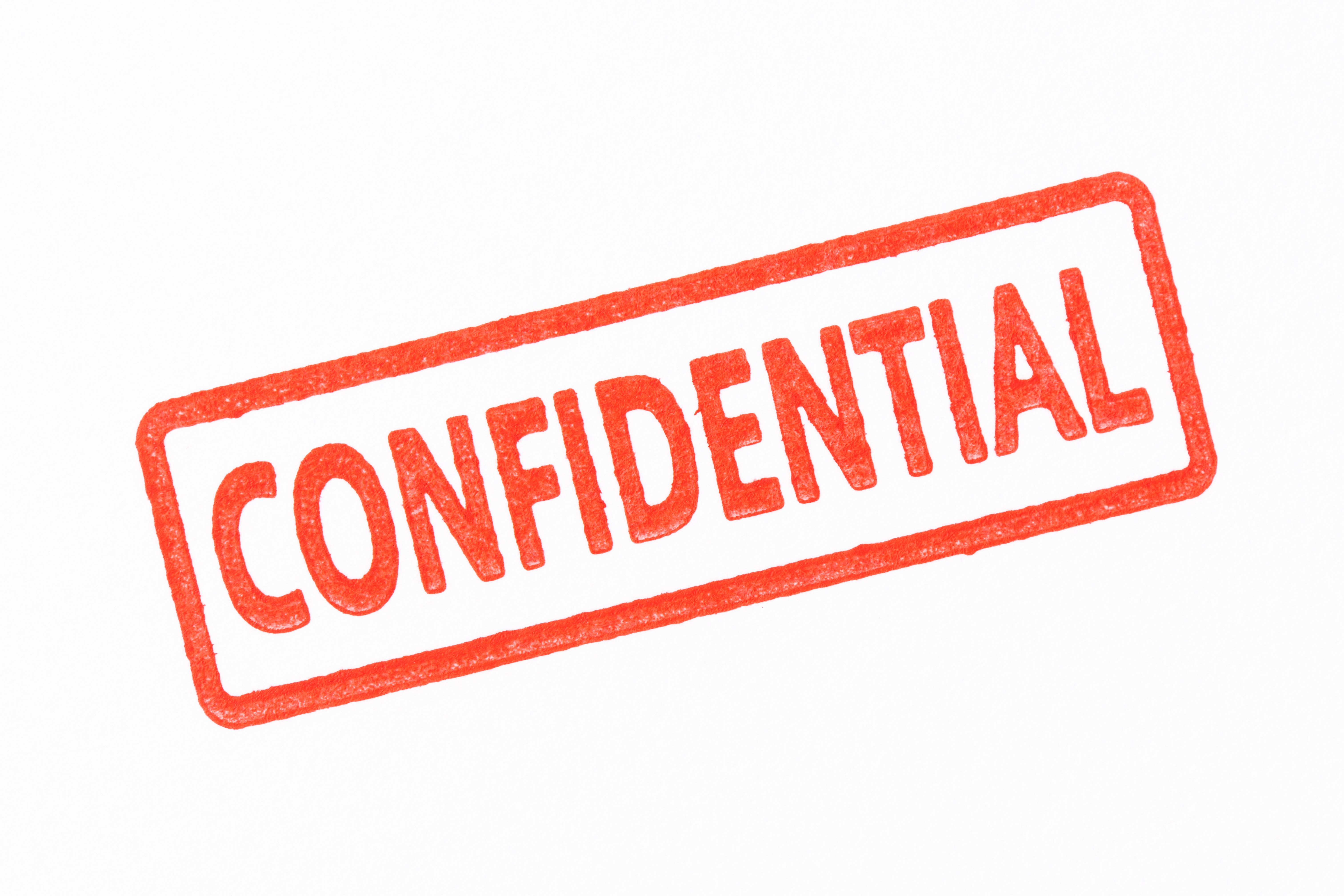 Isolated shot of red CONFIDENTIAL rubber stamp on white background Isolated shot of red CONFIDENTIAL rubber stamp on white background