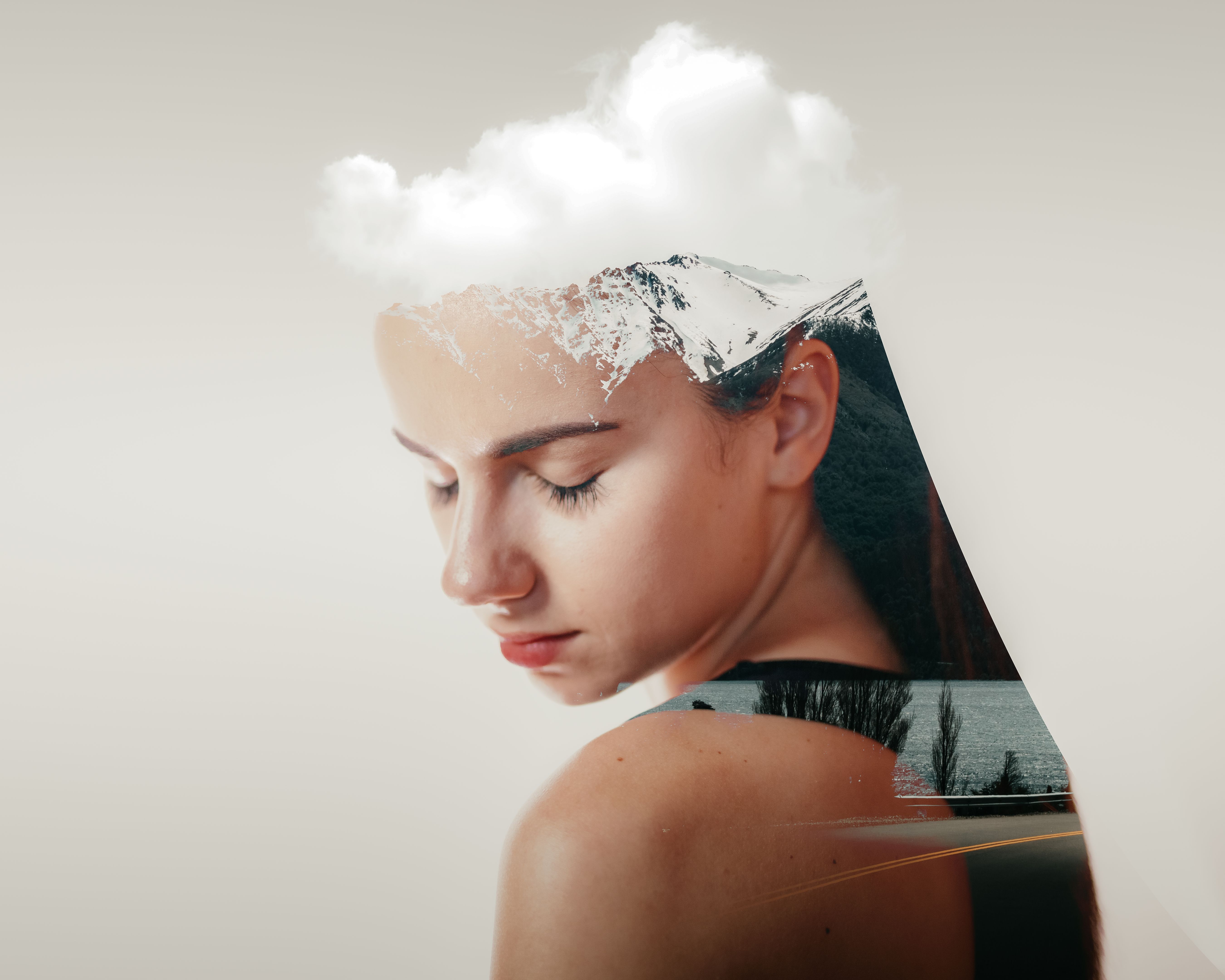 Double exposure of woman and mountain landscape