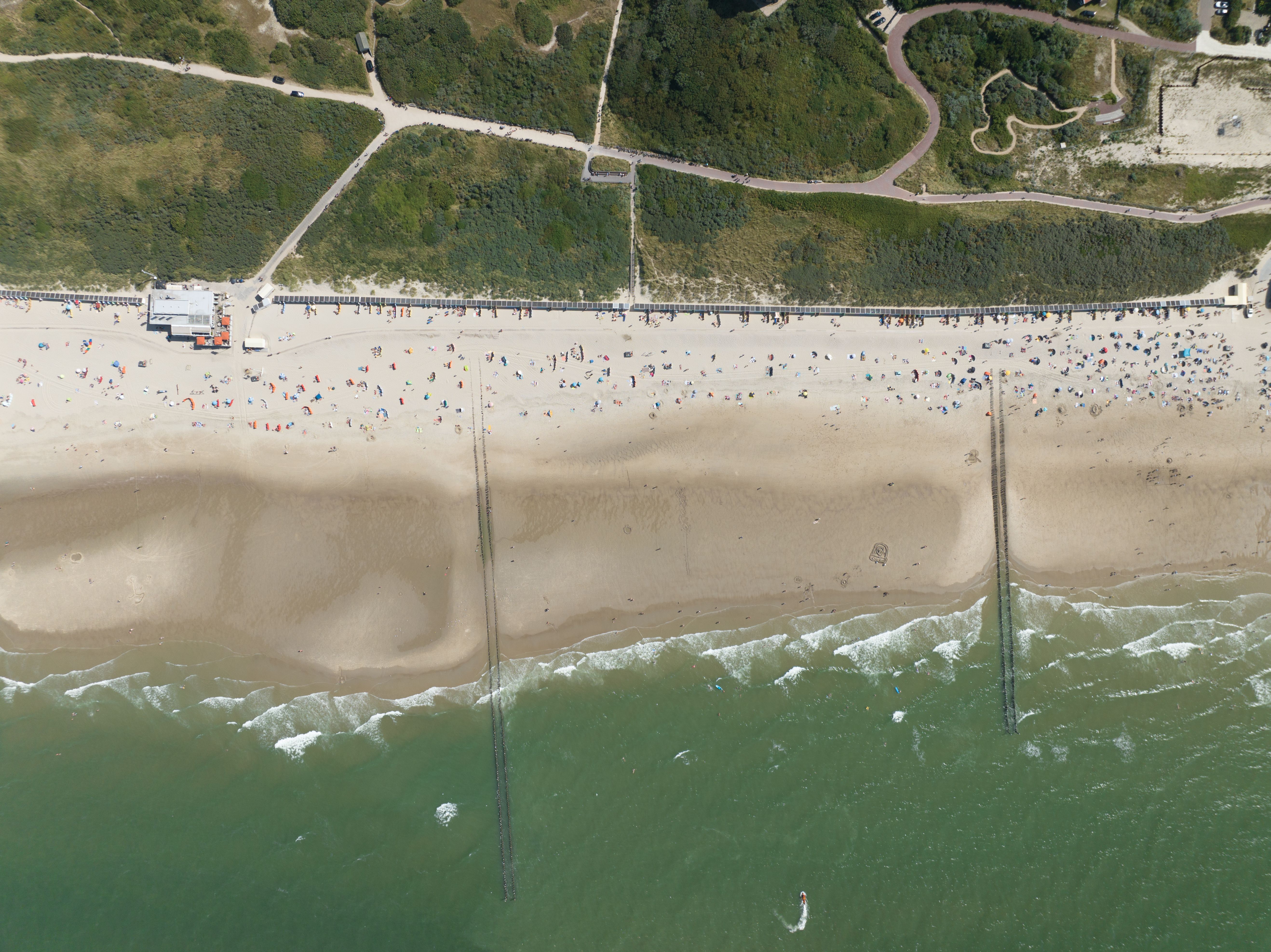 Aerial top down photo of the beach coast of Zeeland, The Netherlands. Summer time.