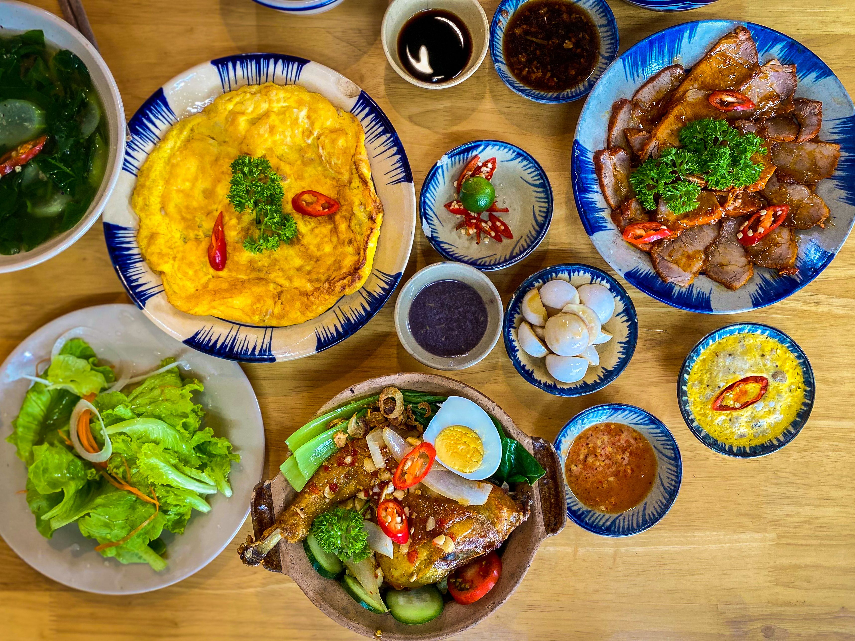 High-Quality Image of a Traditional Vietnamese Family Meal with Rustic Dishes 