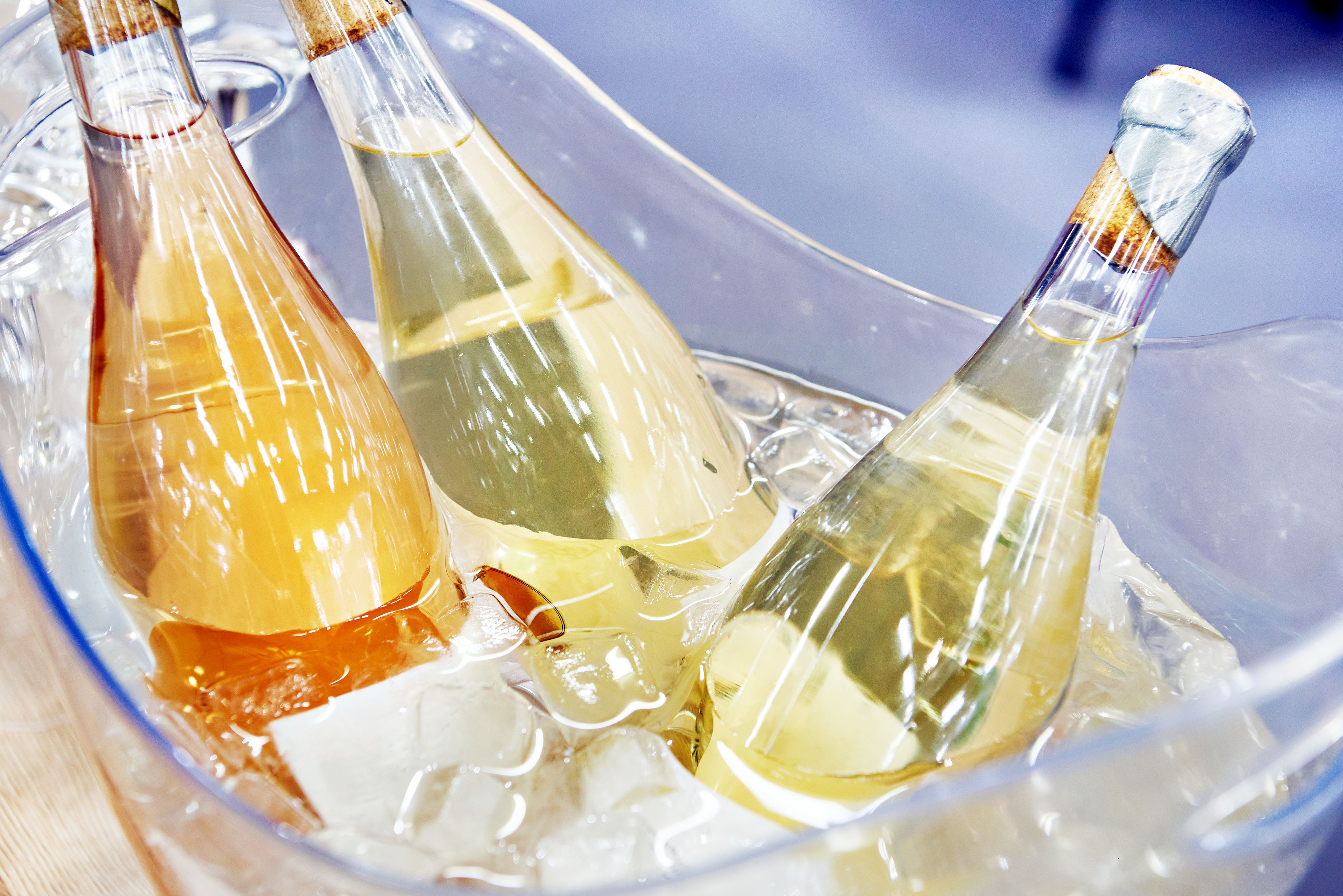 Champagne bottles in ice water