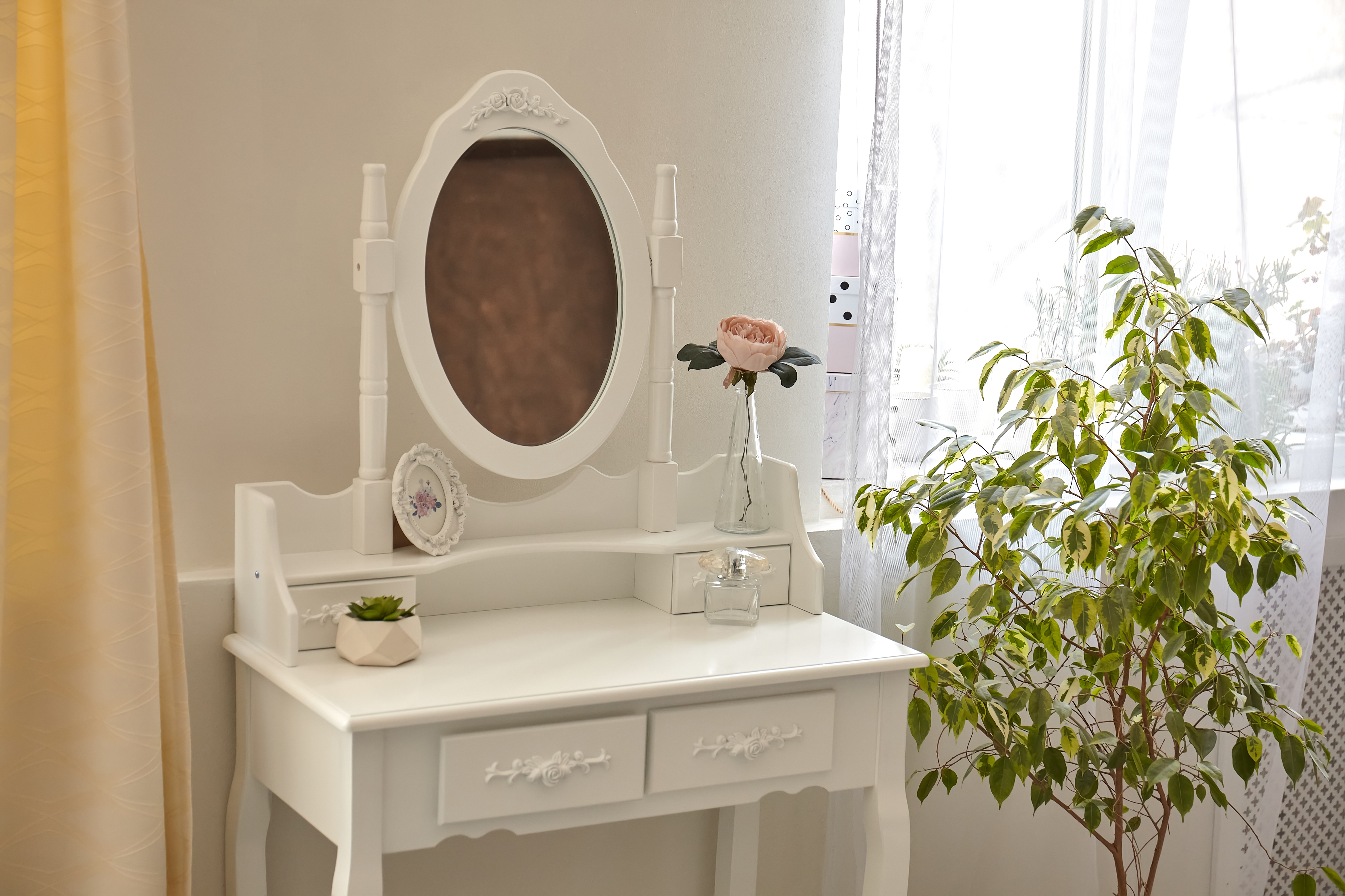 portrait of vintage vanity table set with stool and mirror