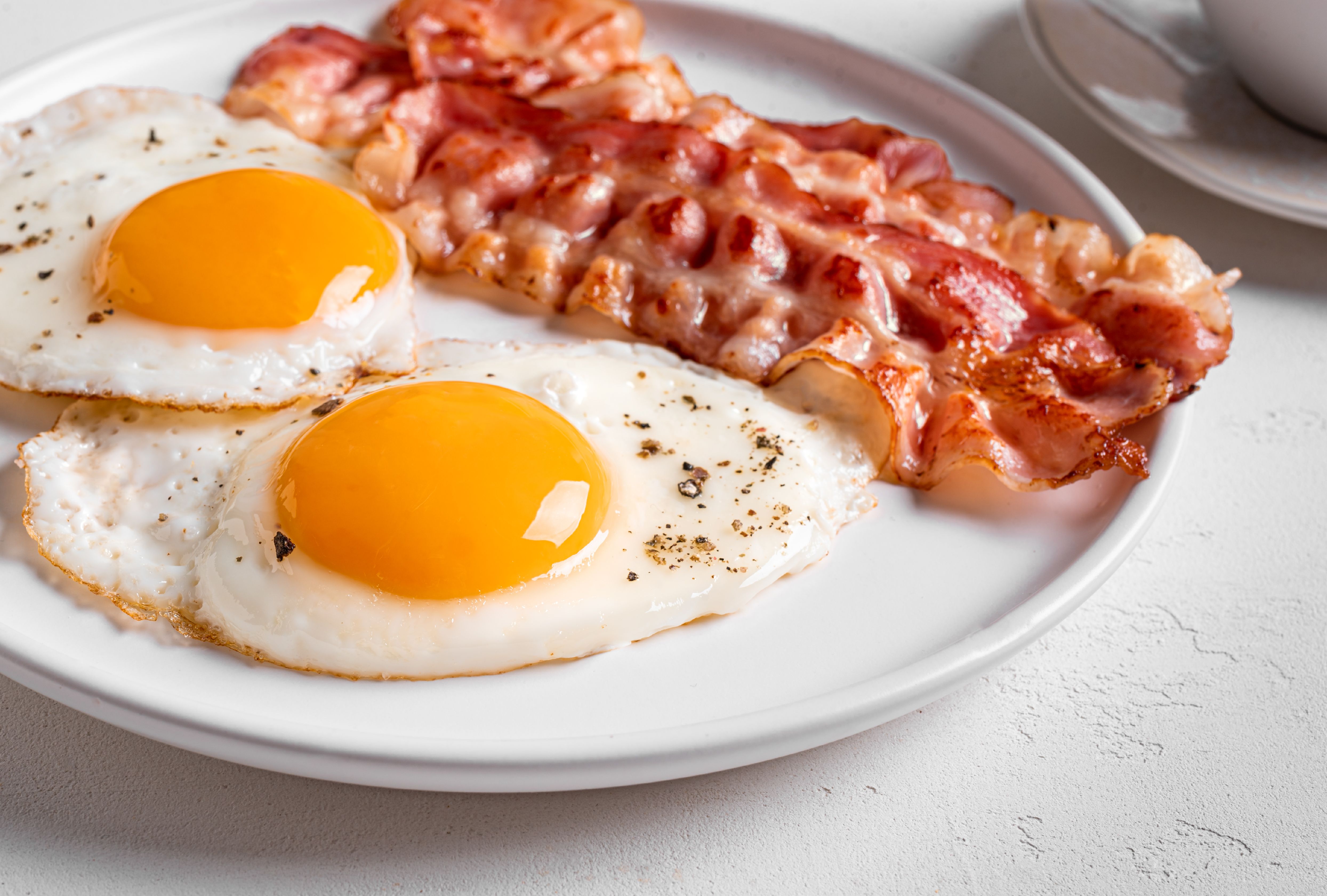Fried eggs and fried bacon