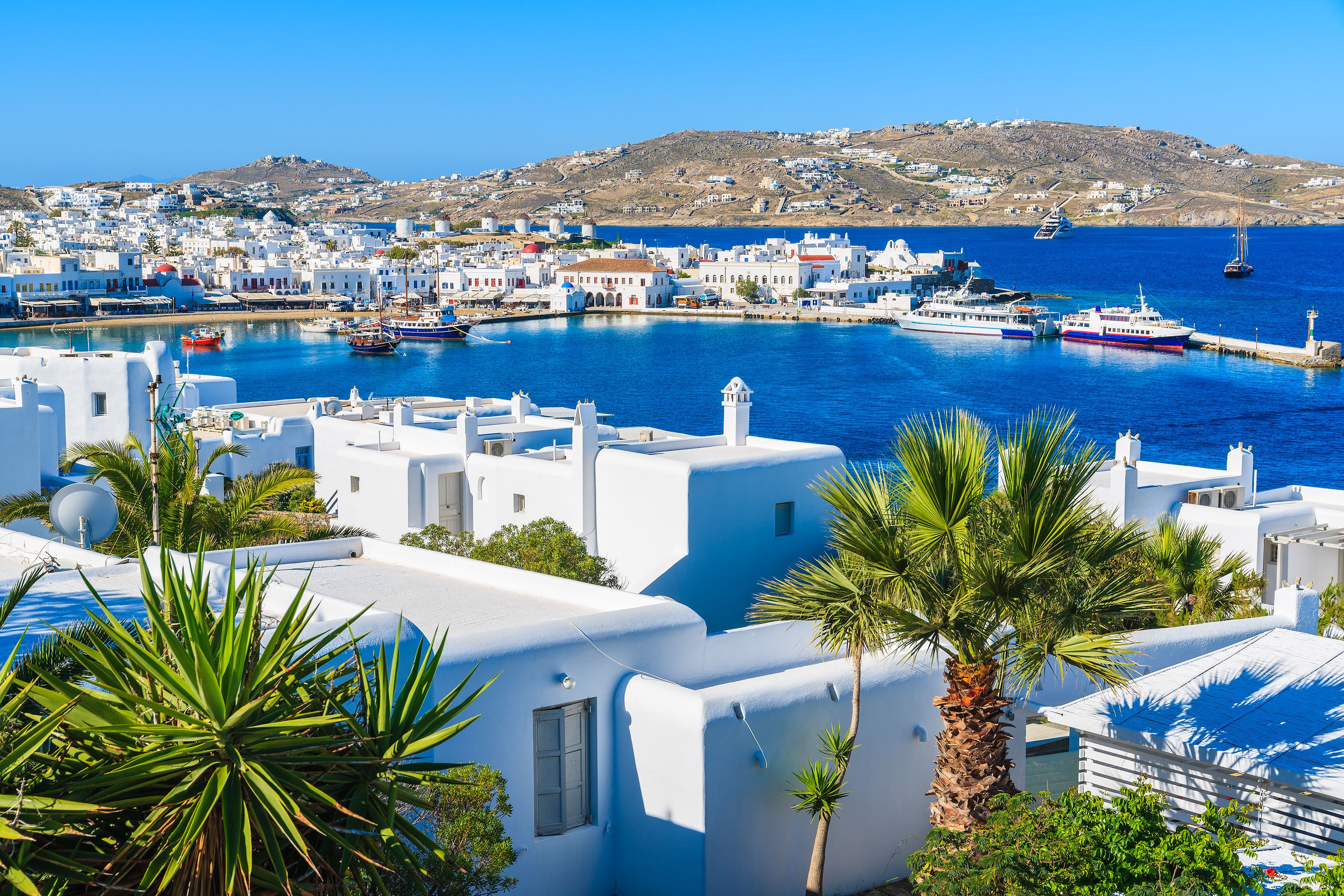 A view of Mykonos port and town, island of Mykonos, Cyclades, Greece A view of Mykonos port and town, island of Mykonos, Cyclades, Greece