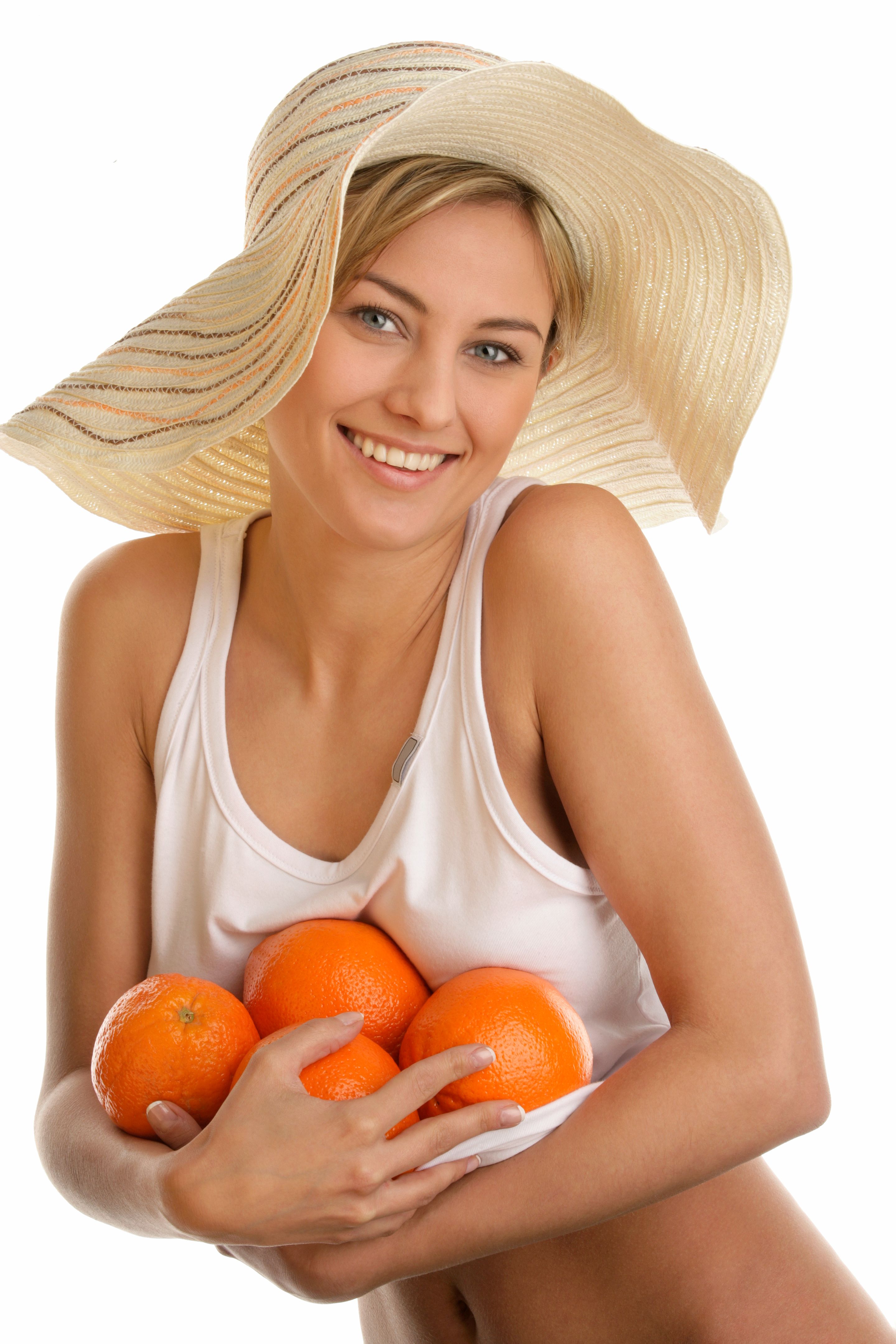 Woman holding fresh oranges