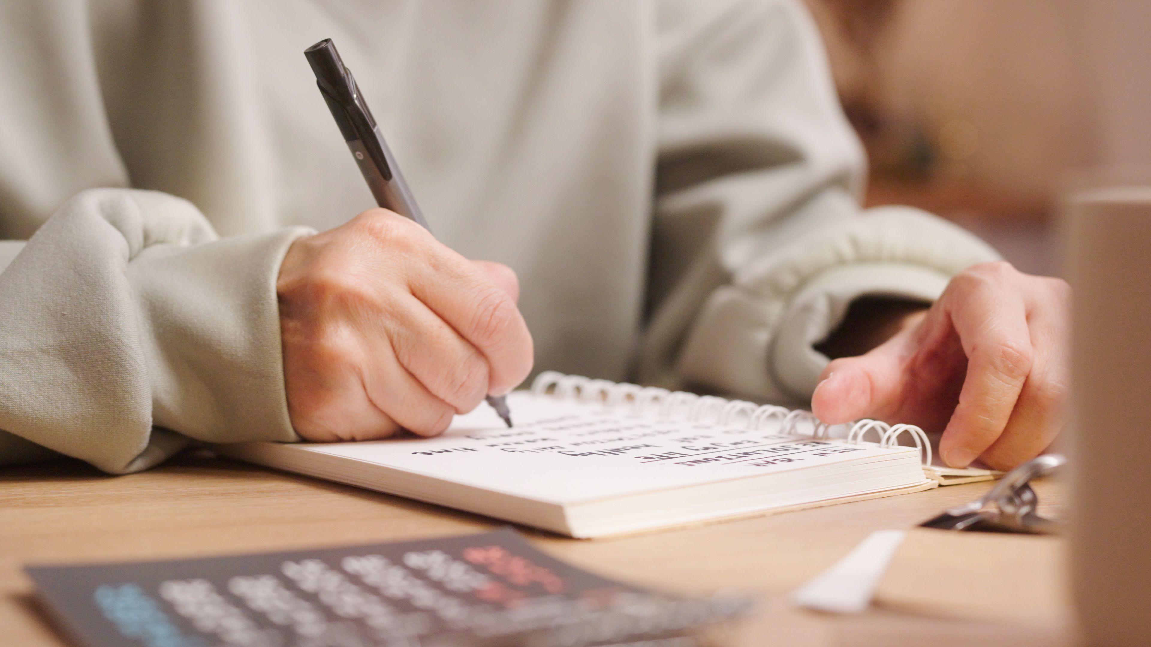 person writing goals