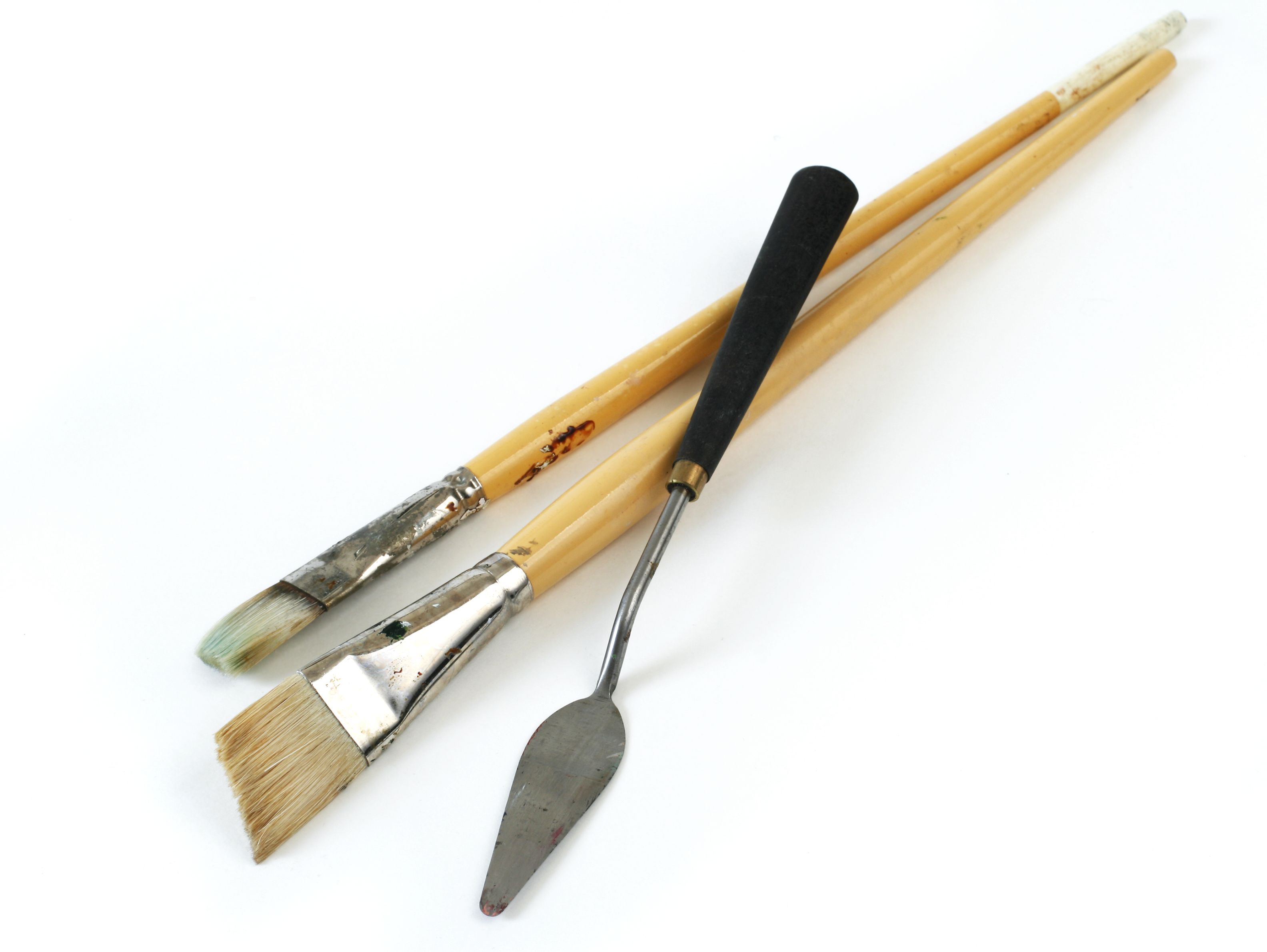 Art supplies. Paint brushes, palette knife. Isolated on white. Vertical. Art supplies. Paint brushes, palette knife. Isolated on white. Vertical.