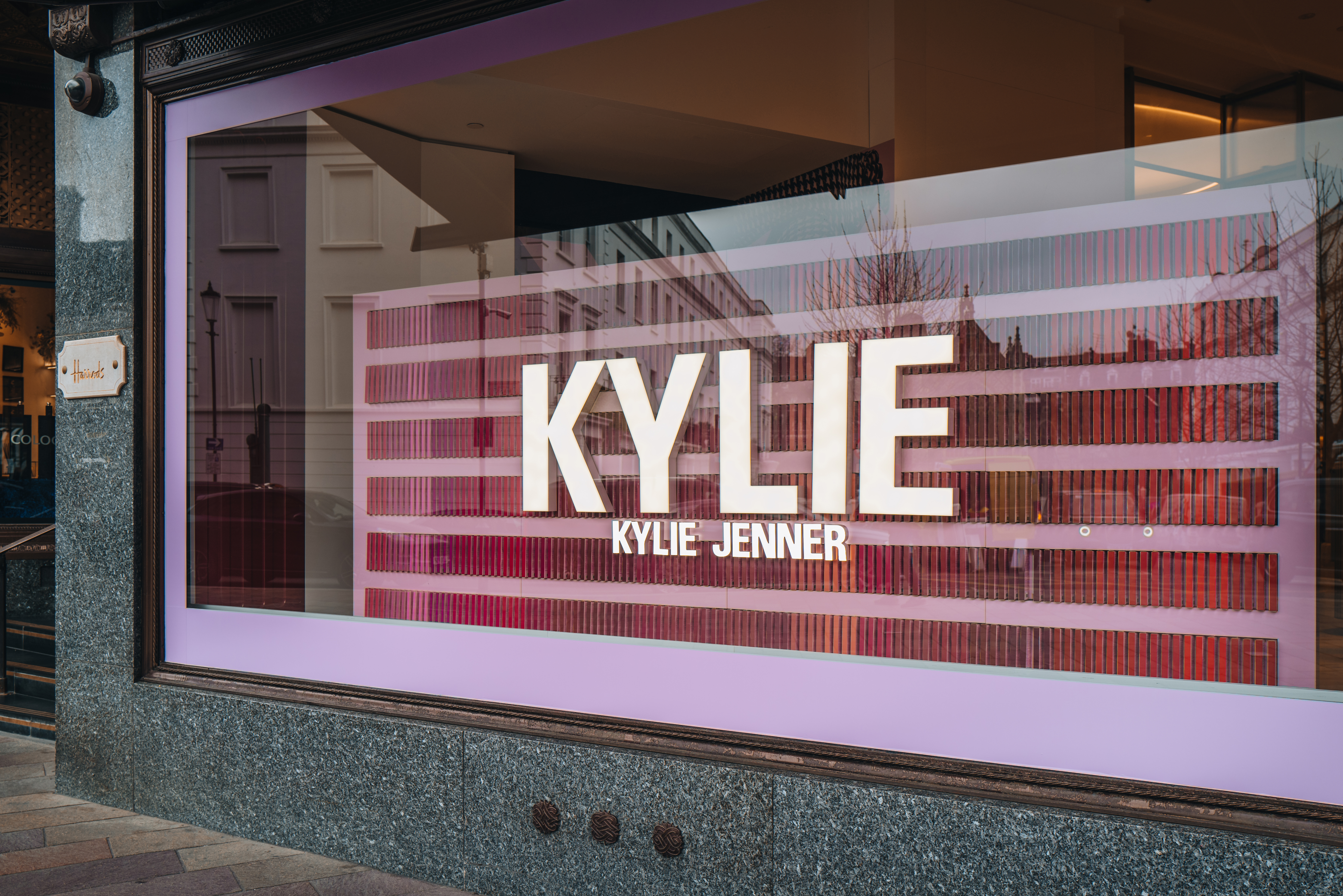 Kylie Cosmetics sign in the window of Harrods department store in Knightsbridge, London, UK.