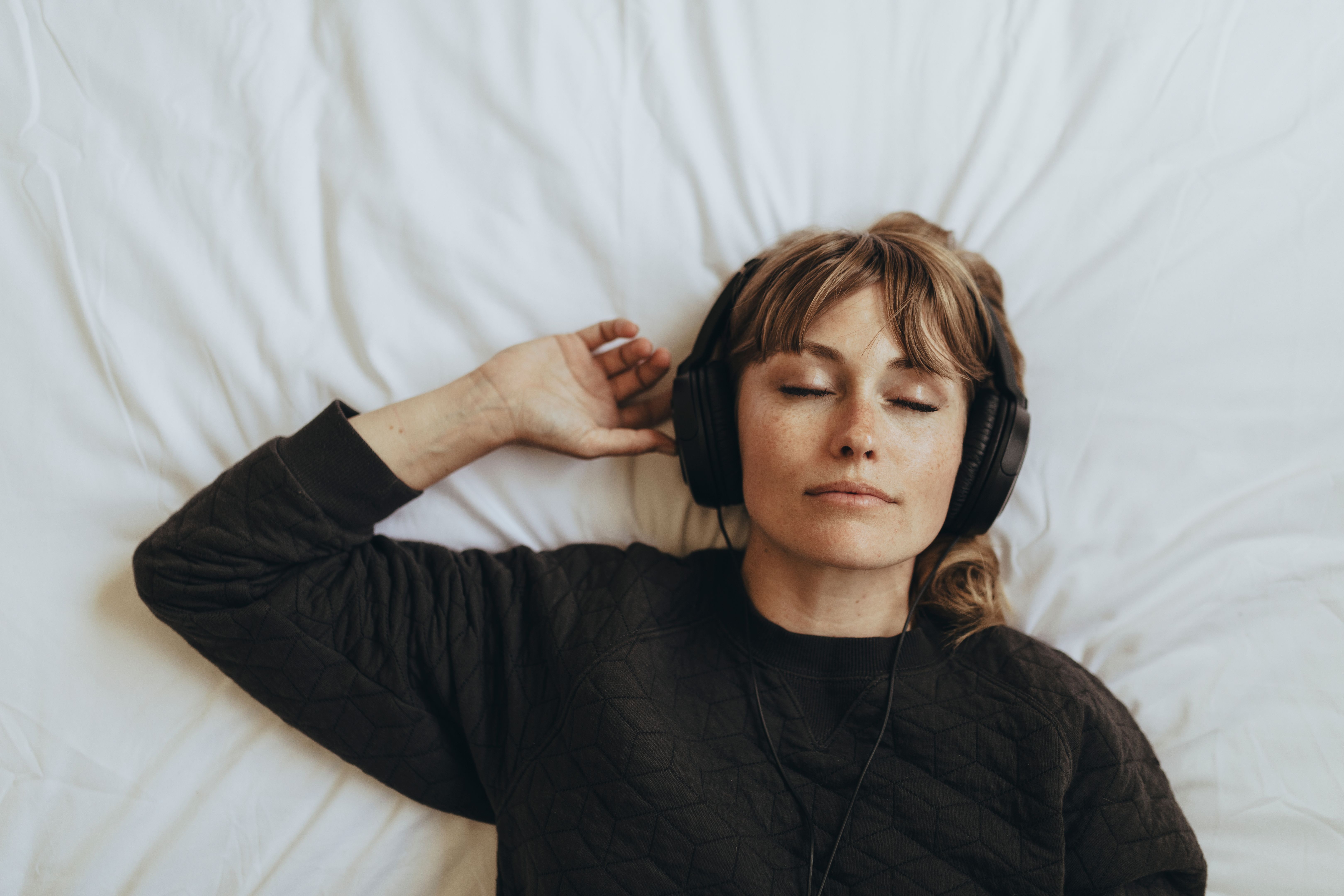 Woman listening to music  during coronavirus quarantine