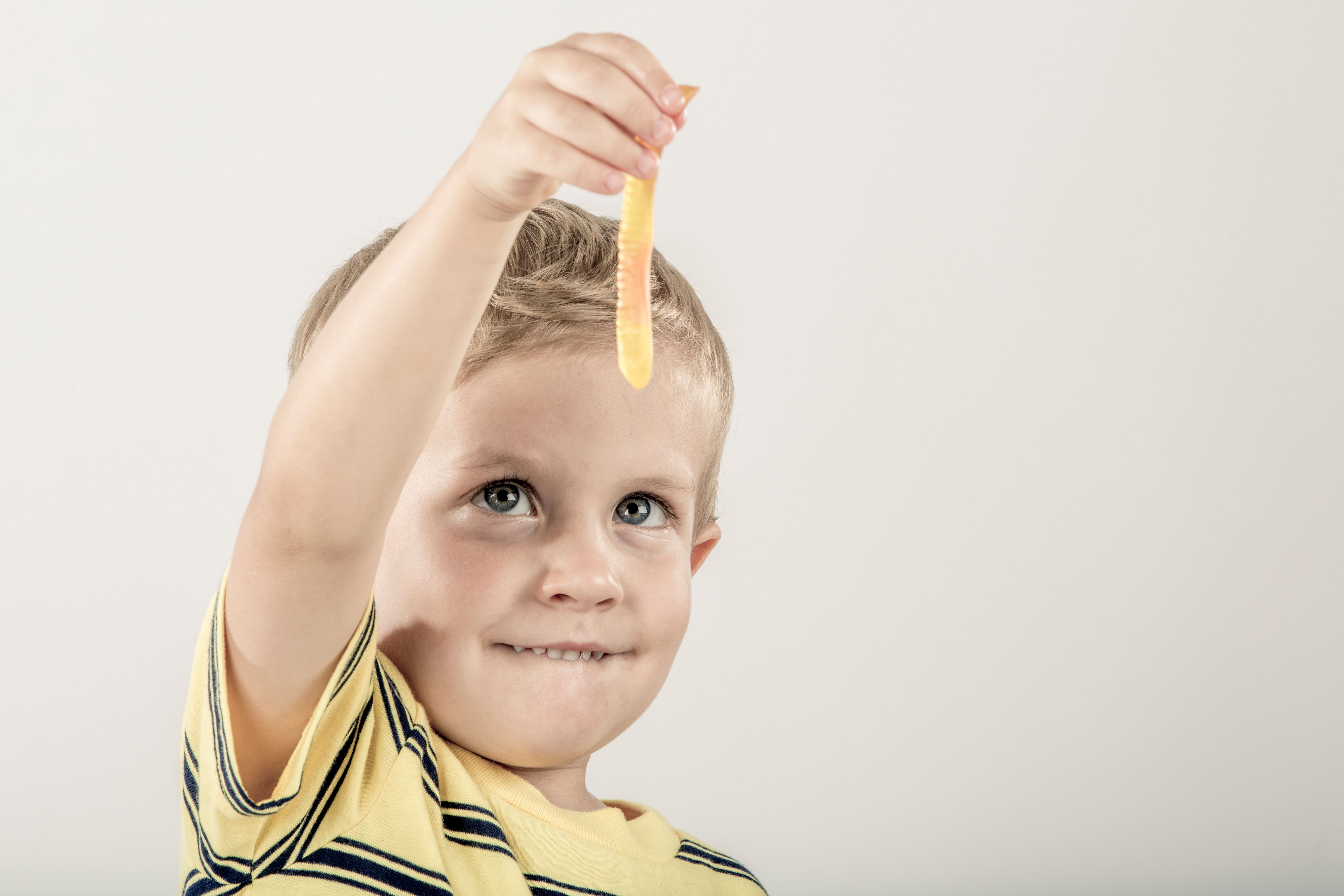 child eating gummy