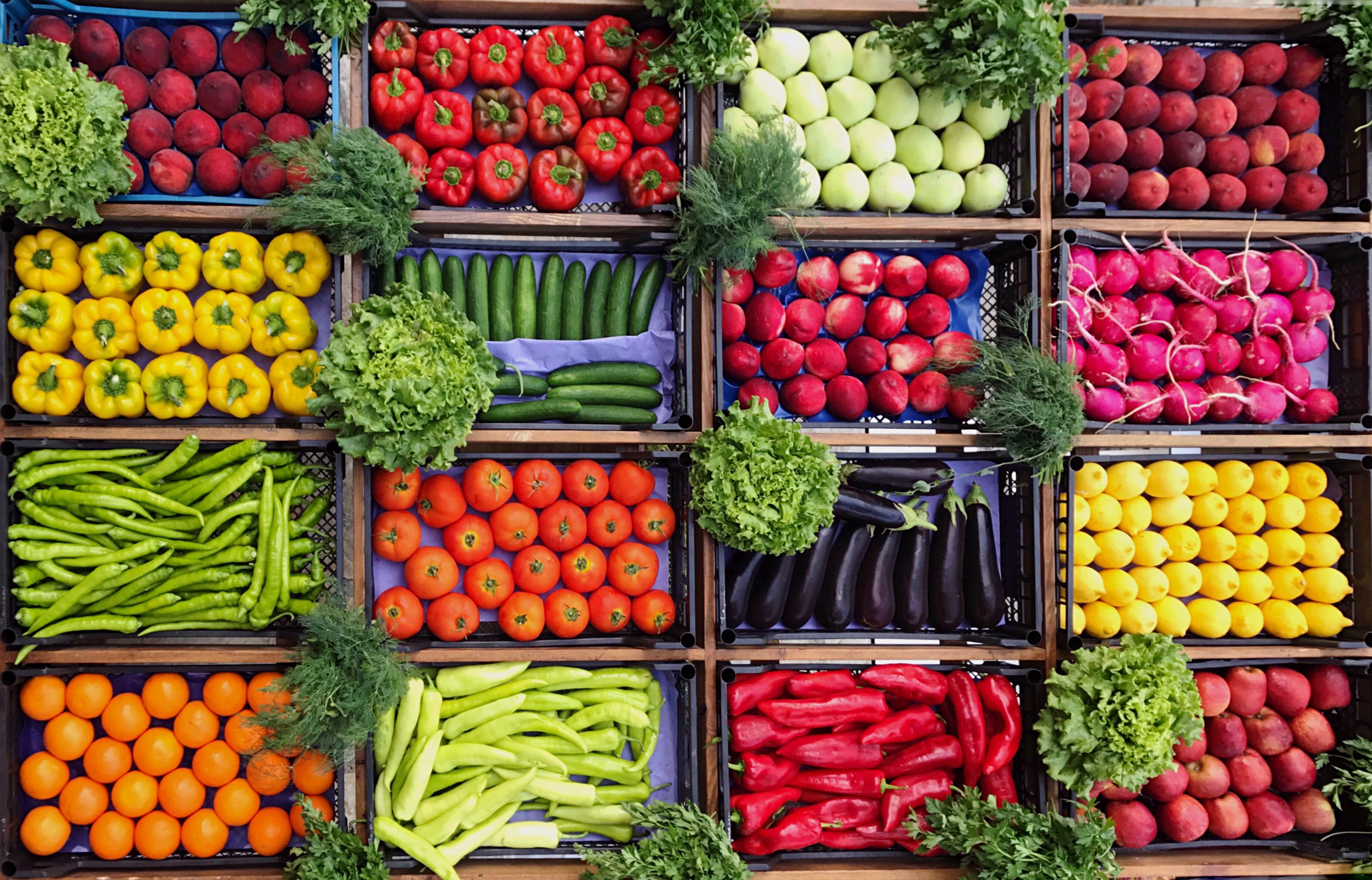 High Angle View Of Various Vegetables And Fruits For Sale At Market Stall