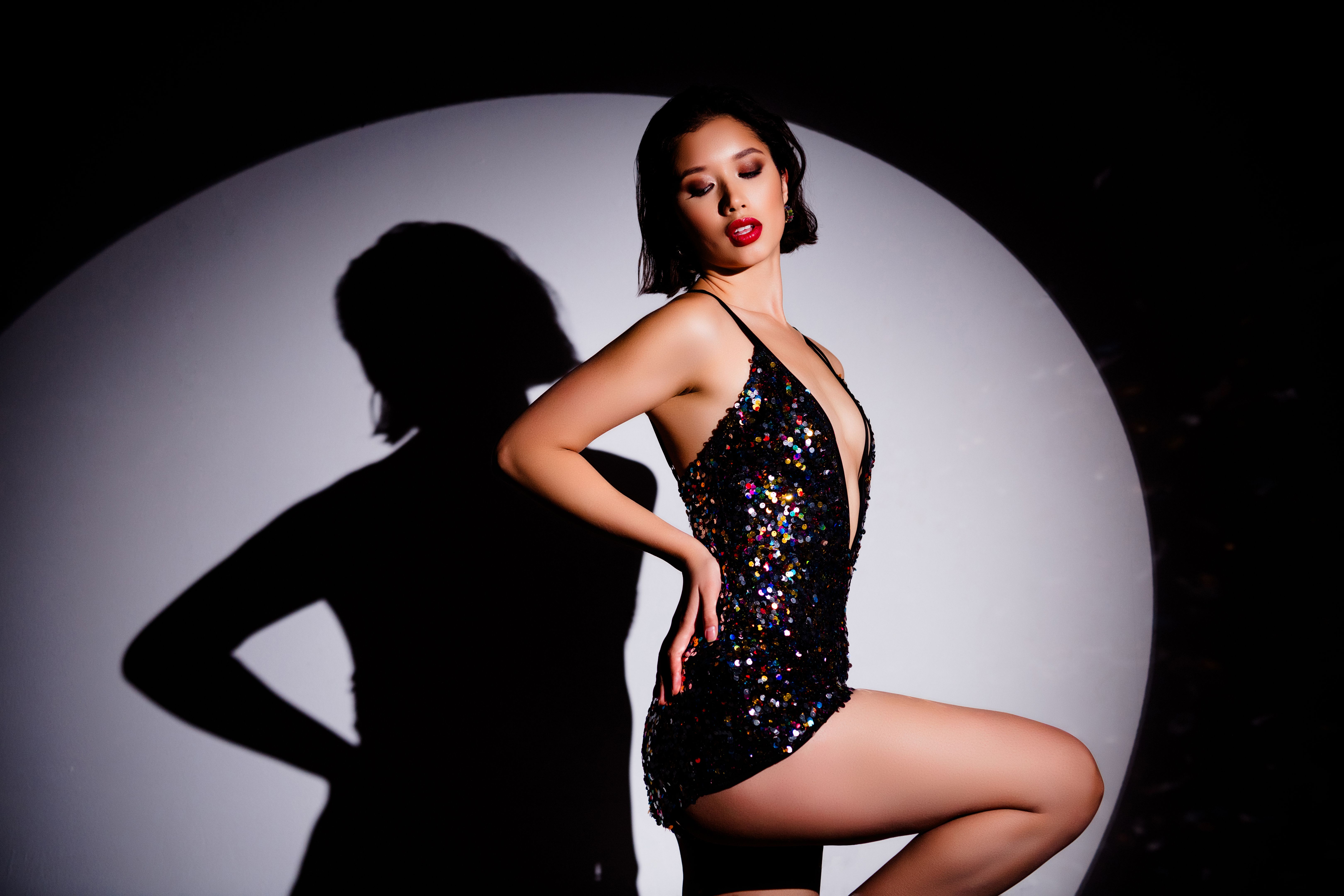 Profile portrait of charming famous movie actress hand touch waist posing shadow silhouette spotlight