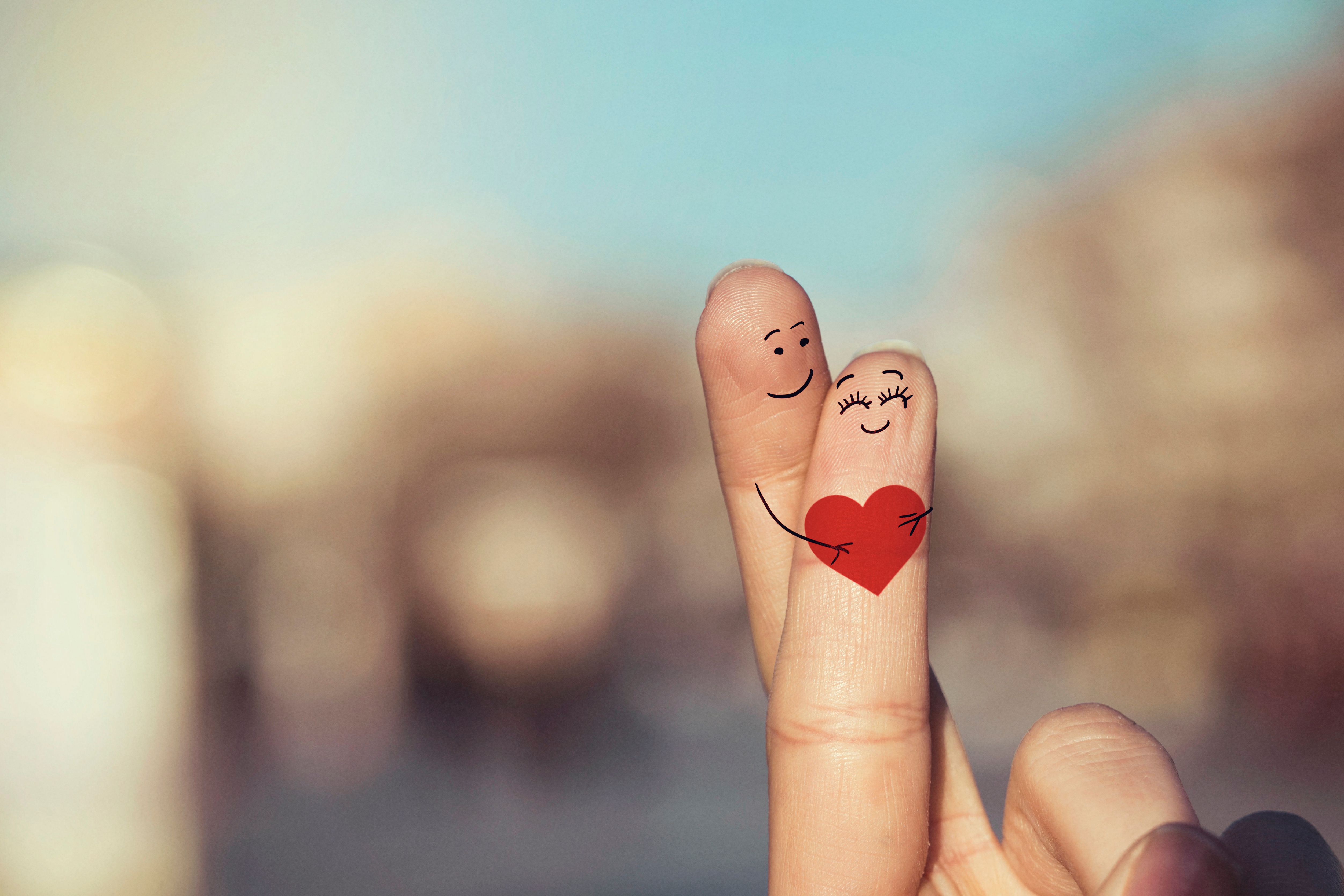 Happy loving fingers holding red heart Happy loving fingers holding red heart