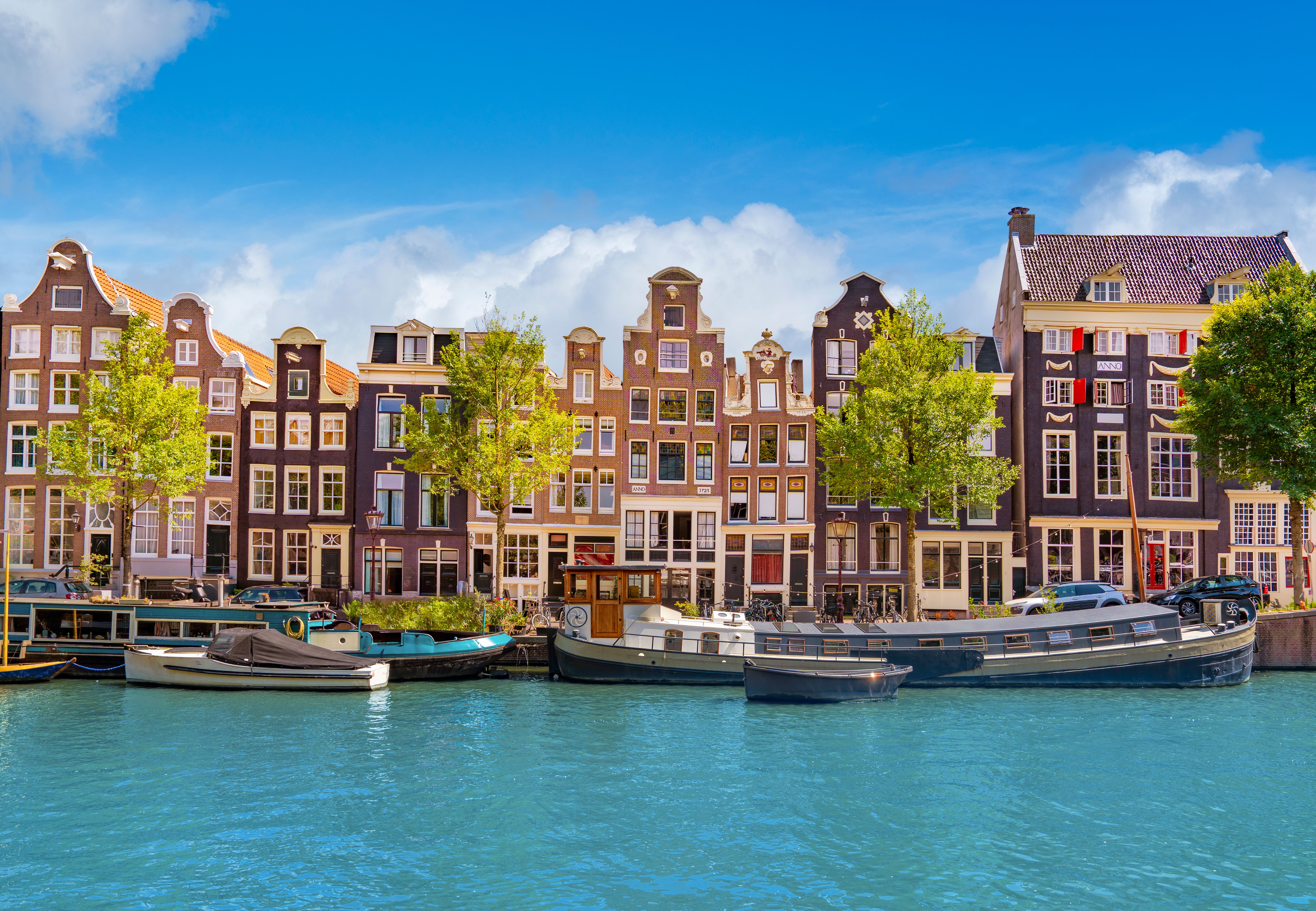 Historic gabled houses along Singel canal in Amsterdam