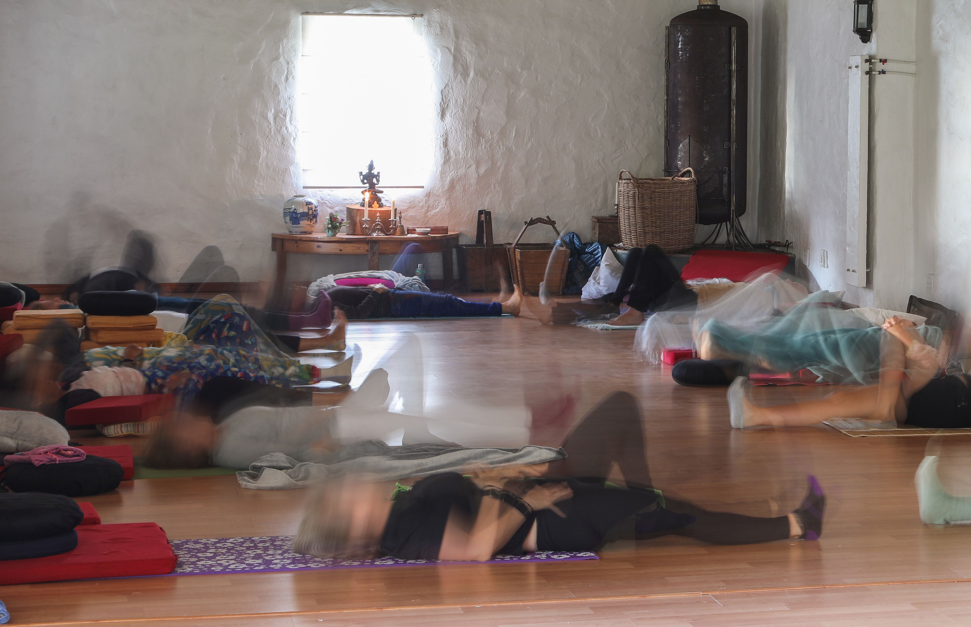 Unrecognizable people preparing for a group meditation session at a mindfulness retreat near Cape Town, South Africa.