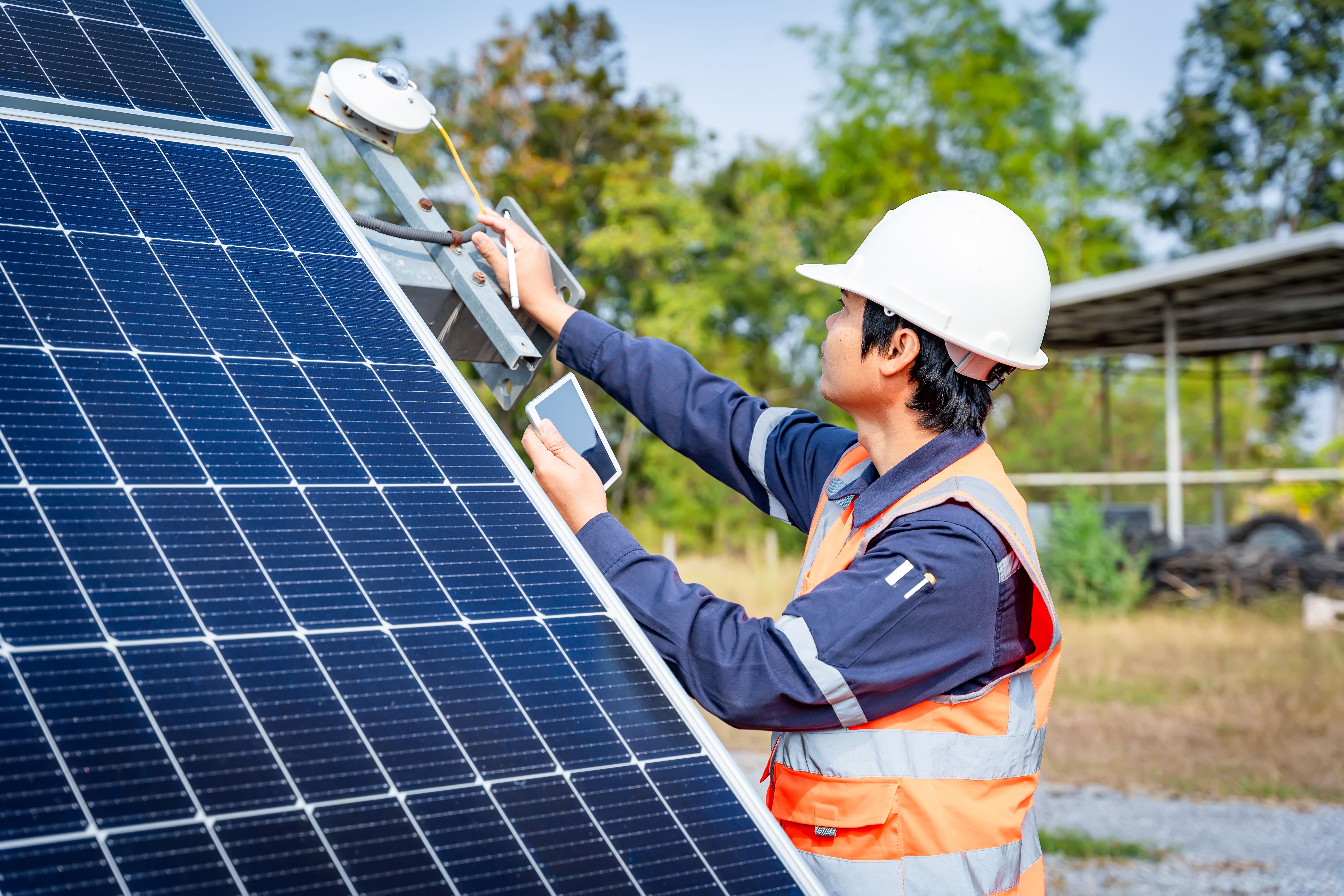 SKM solar course participant performing visual checks on panel fixtures at CAN Academy Selangor