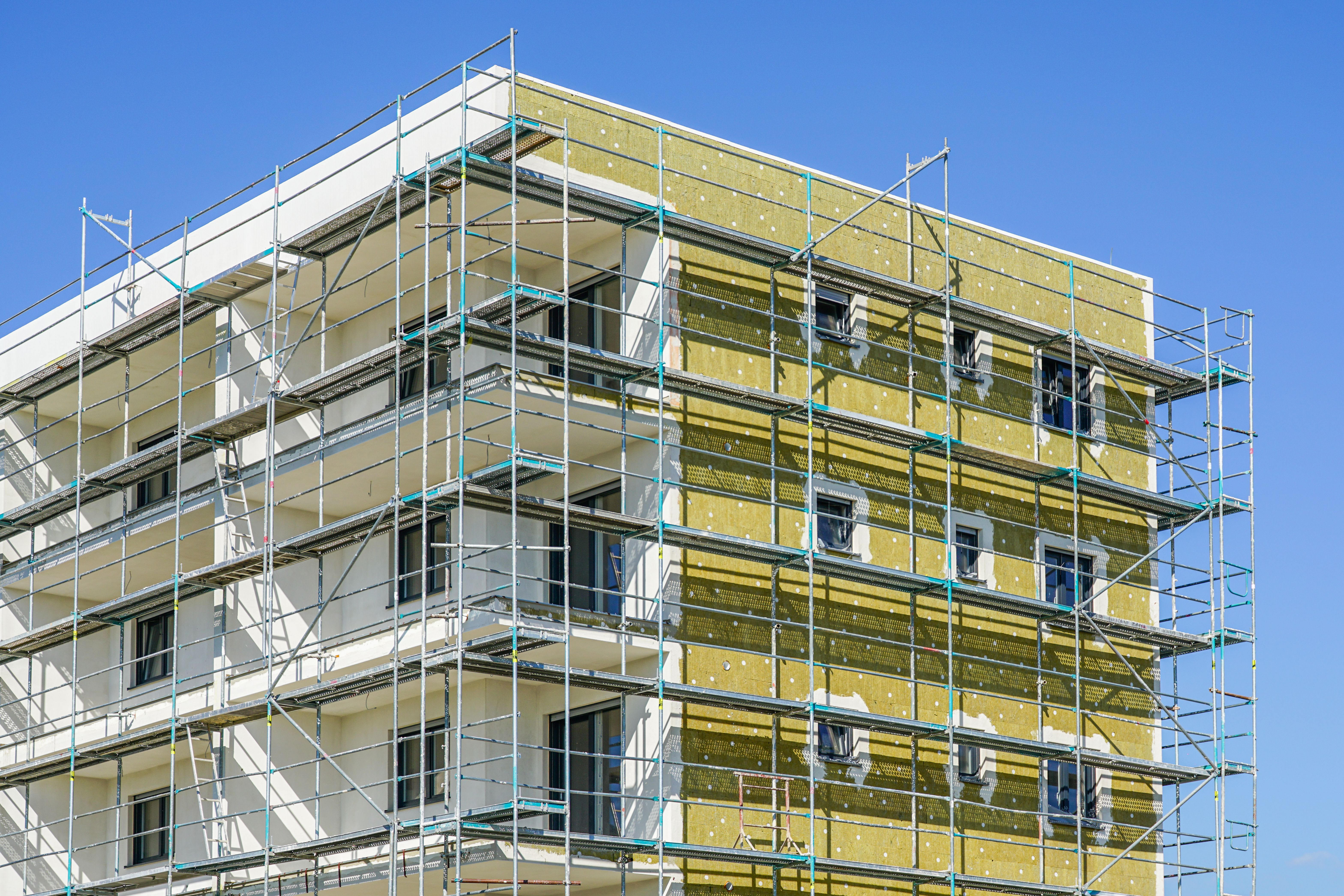 Thermal insulation of the facade of a apartment building with mineral wool plates