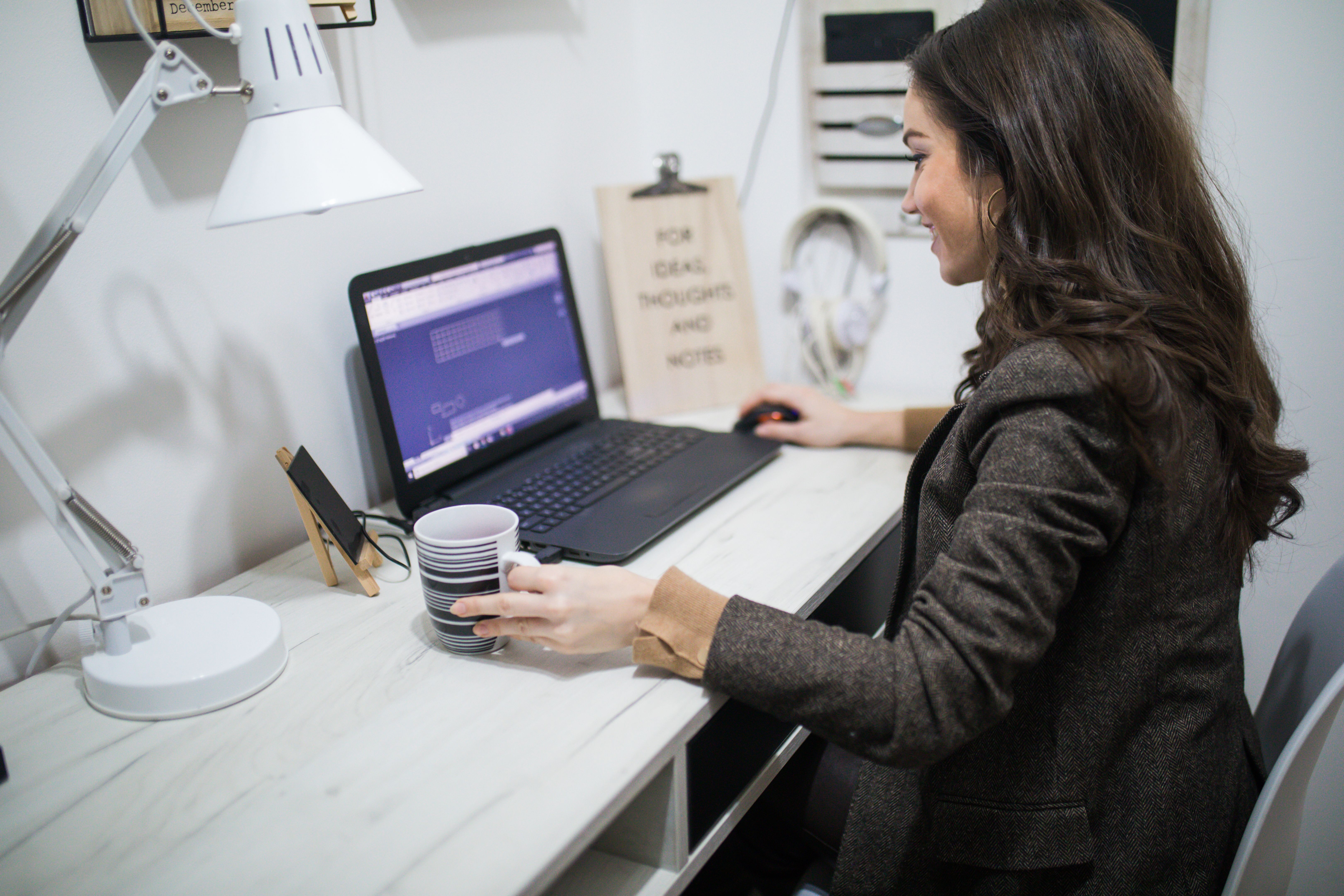 businesswoman entrepreneur working on laptop from home office space businesswoman entrepreneur working on laptop from home office space