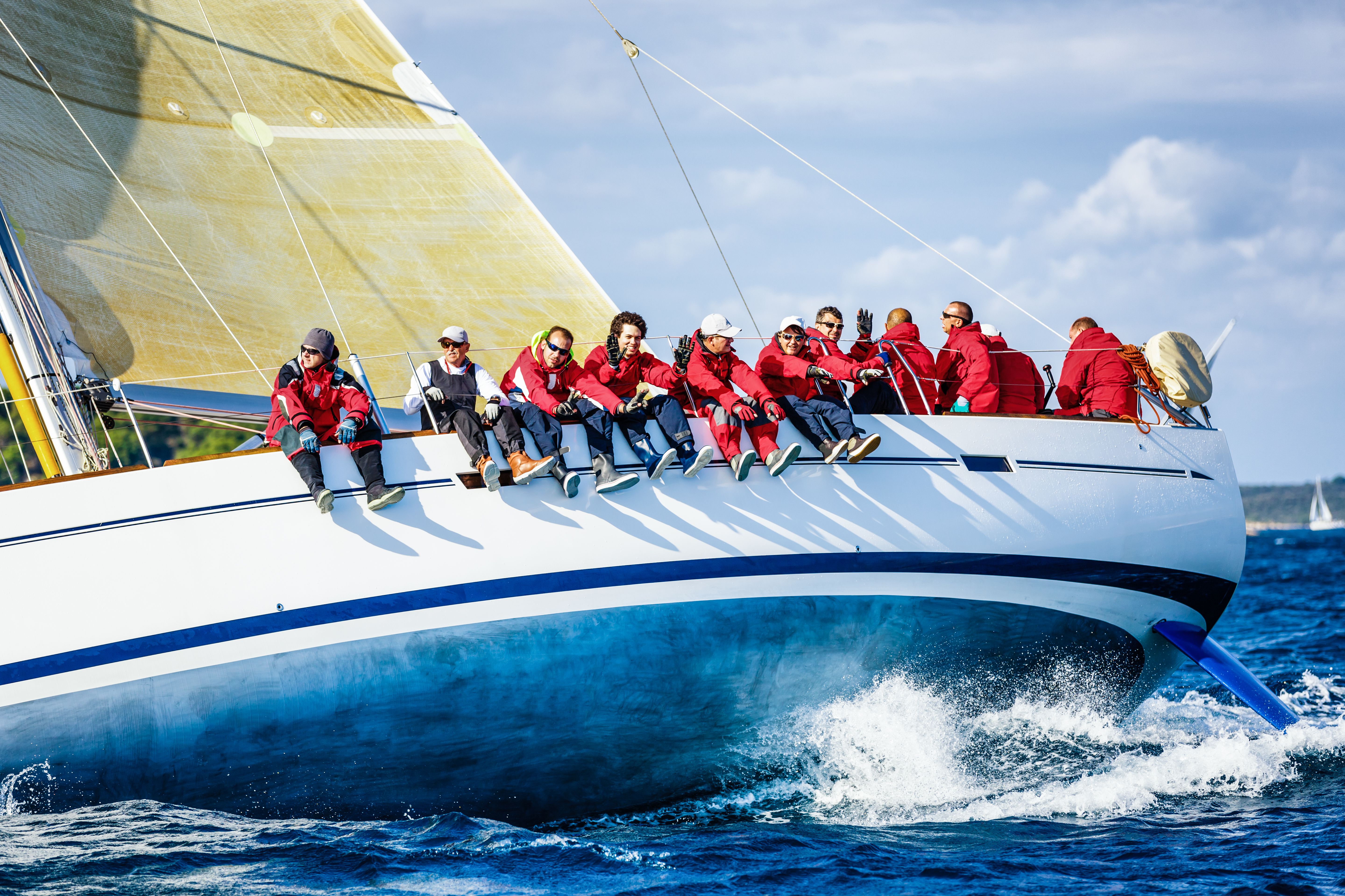 Sailing crew on sailboat during regatta