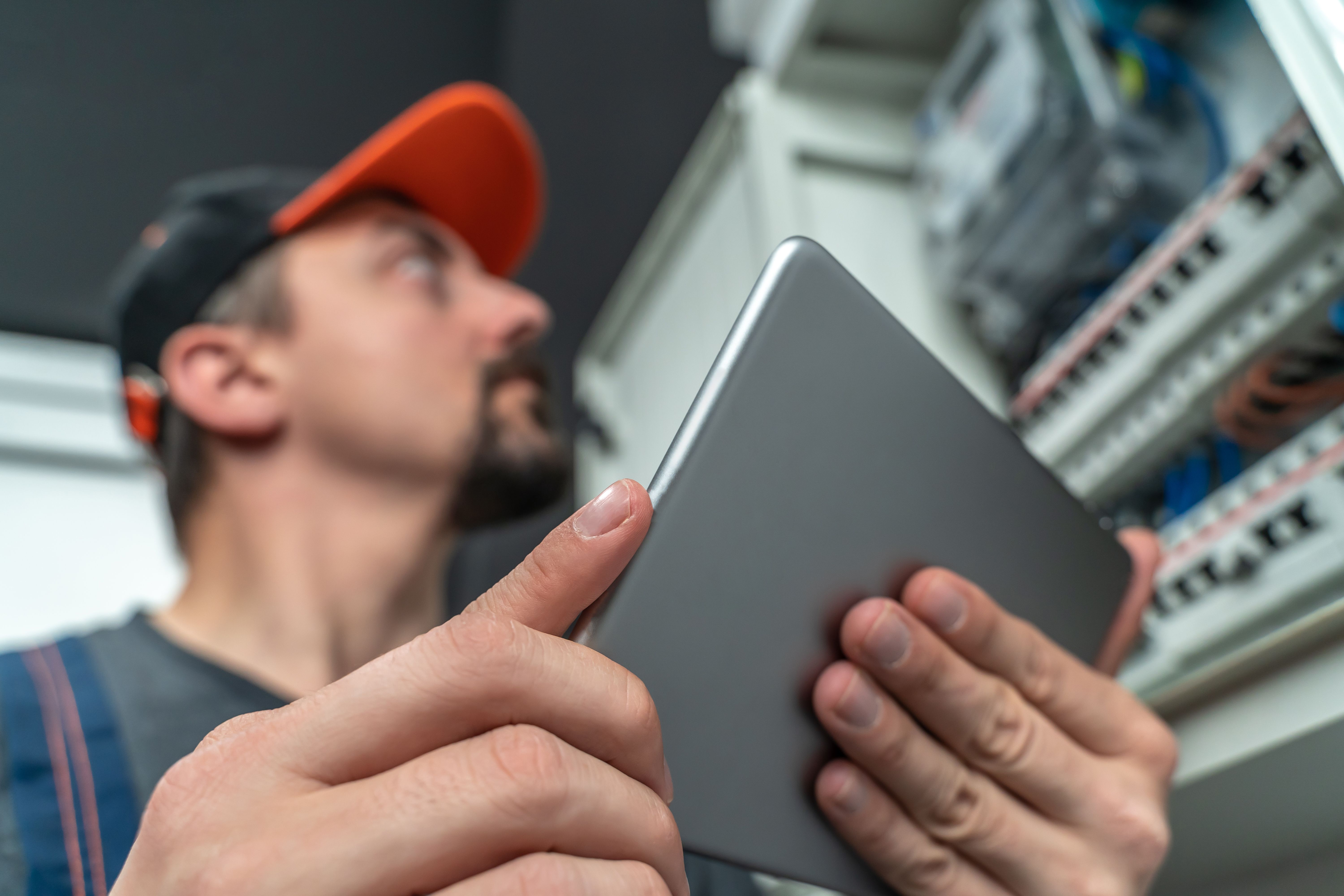 electrician inspecting panel