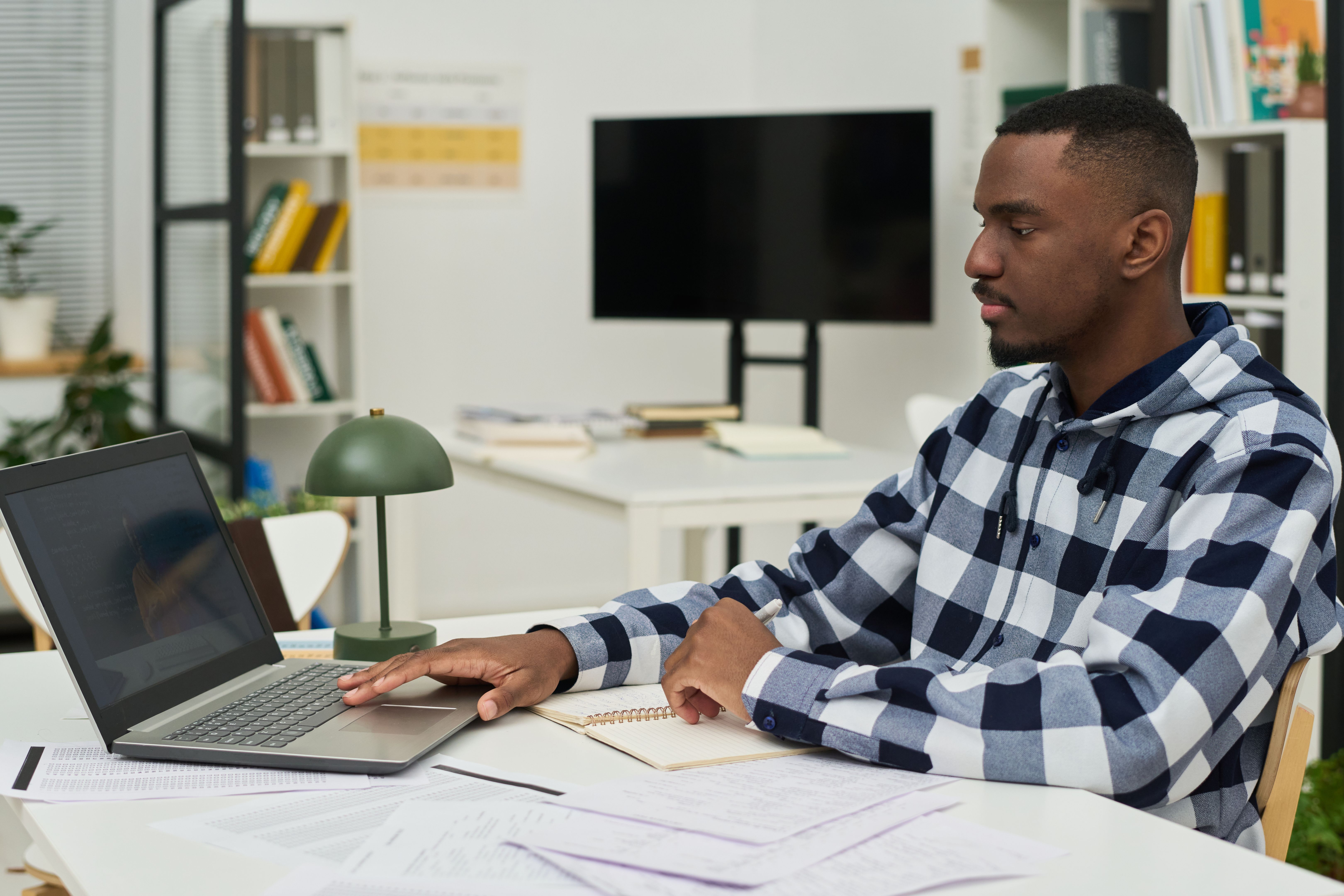 Concentrated Man Studying Foreign Languages in Classroom