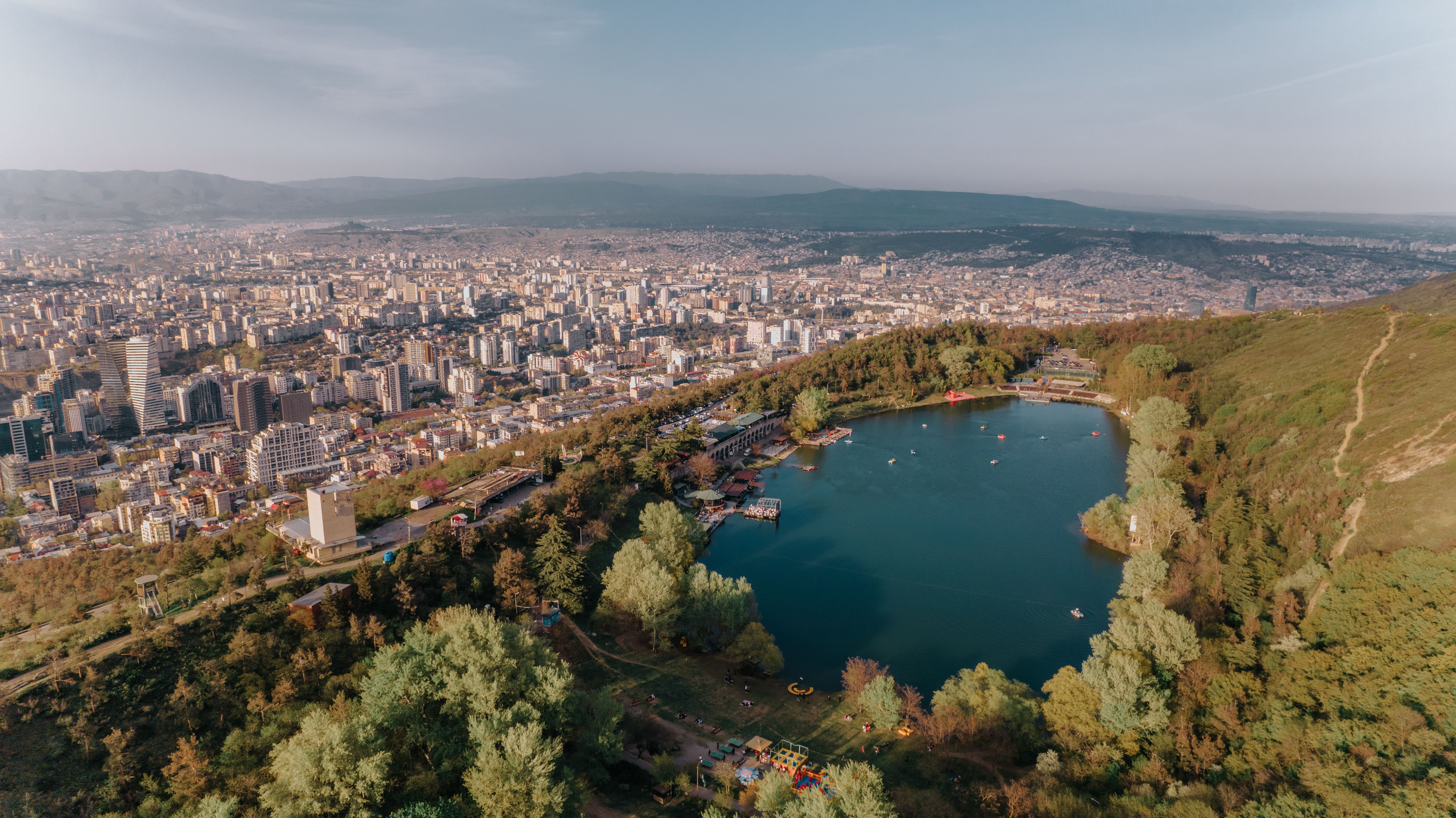 Aerial view of Turtle Lake with the Tbilisi cityscape in the background in Georgia
