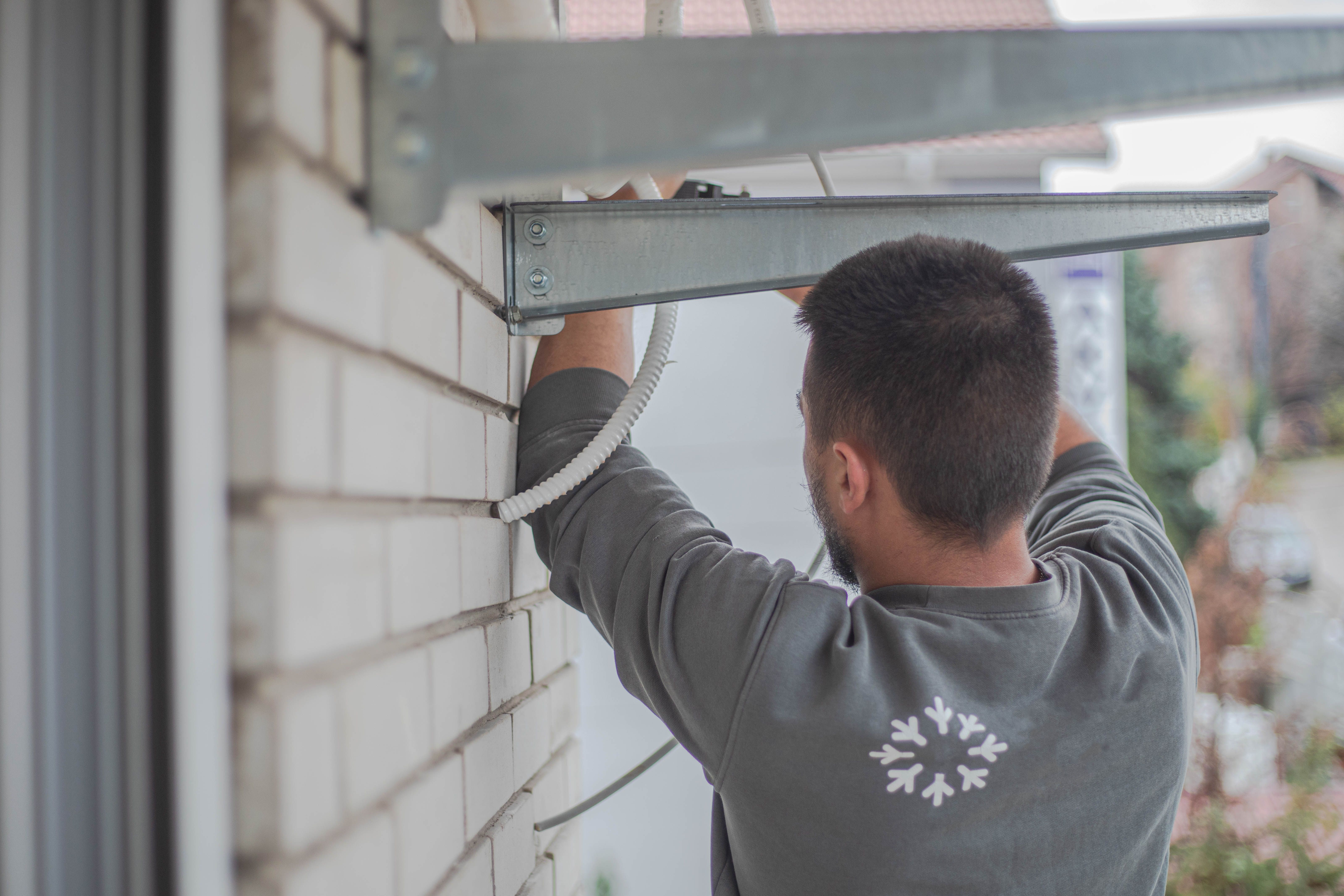 technician repairing shutter