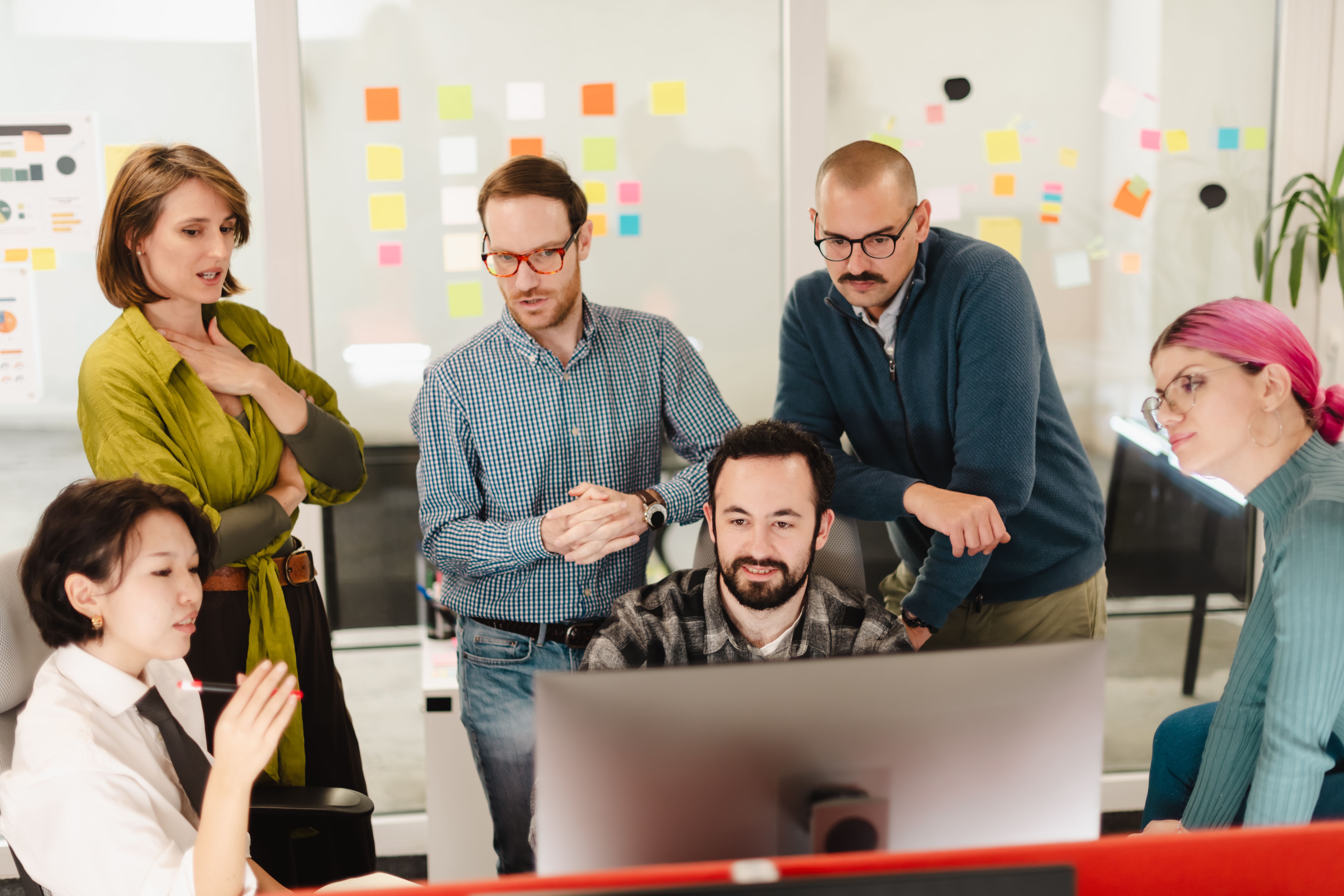Business team collaborating in a modern office setting during a brainstorming session with colorful sticky notes around them With the top business consultant in Crowley Texas Business team collaborating in a modern office setting during a brainstorming session with colorful sticky notes around them With the top business consultant in Crowley Texas