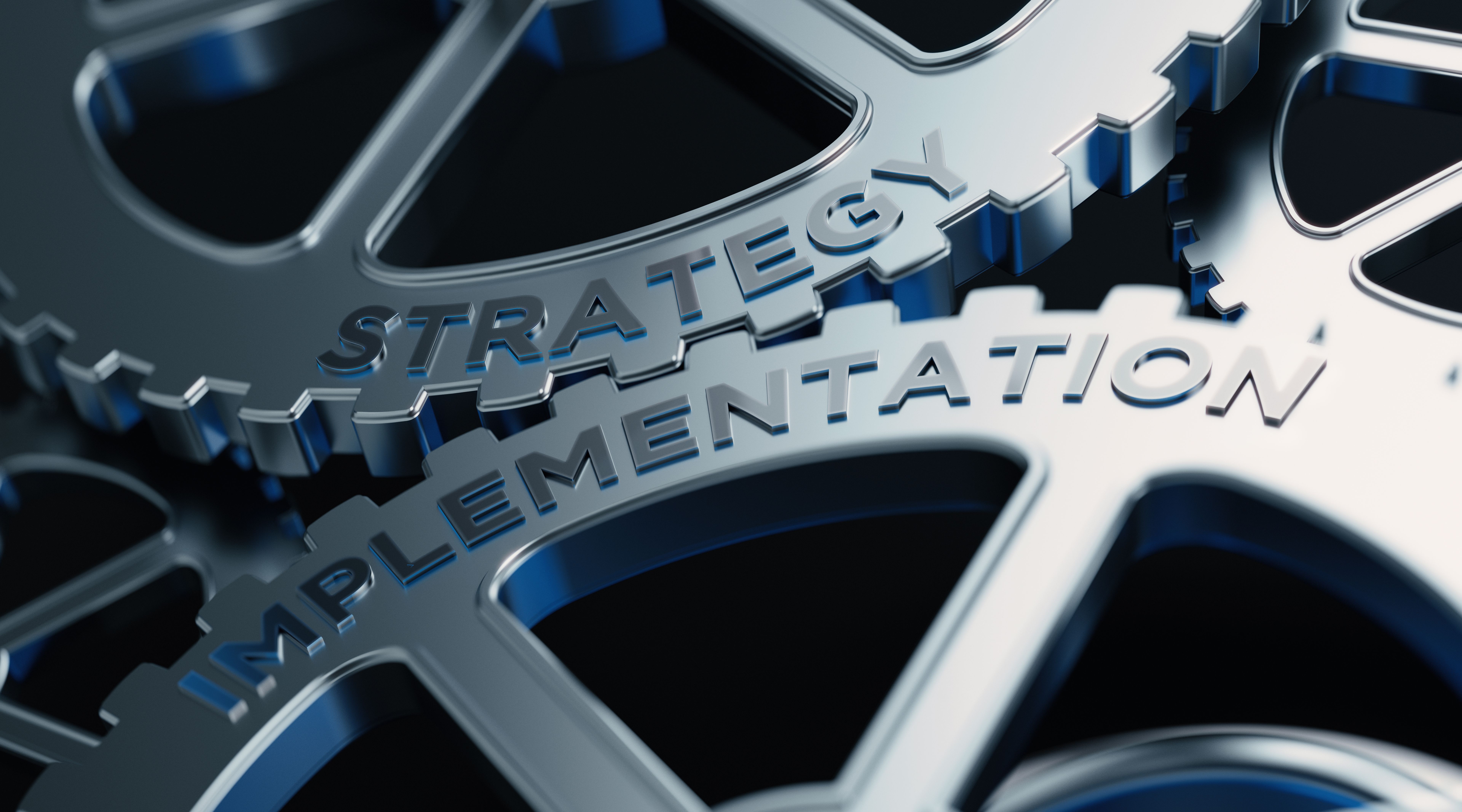 Metal Cogs With Strategy And Implementation Text - Strategy Concept Metal Cogs With Strategy And Implementation Text - Strategy Concept