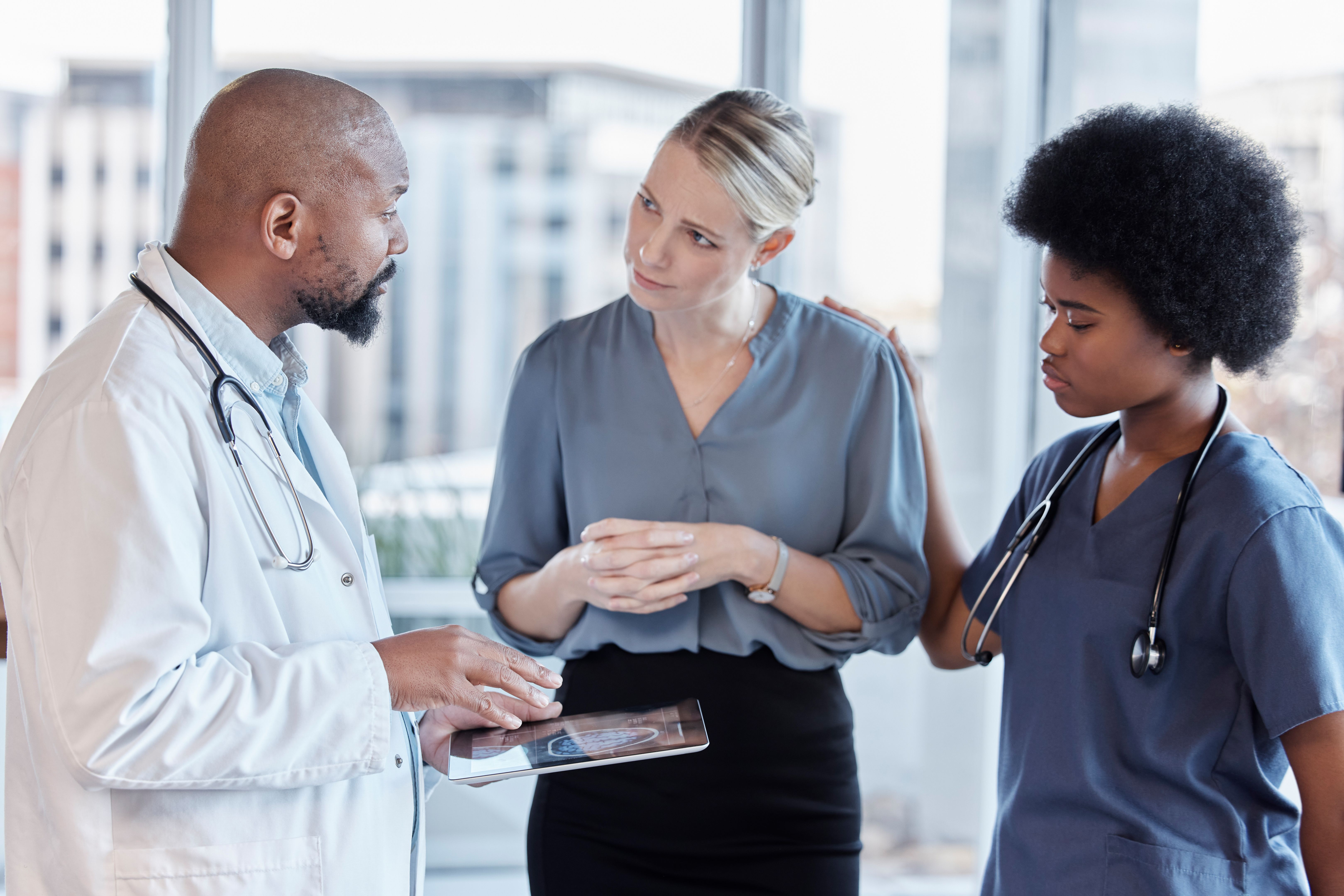 Tablet, doctors and business woman planning, healthcare service and management, schedule and teamwork. Nurse, medical professional and people on digital technology for feedback or hospital data