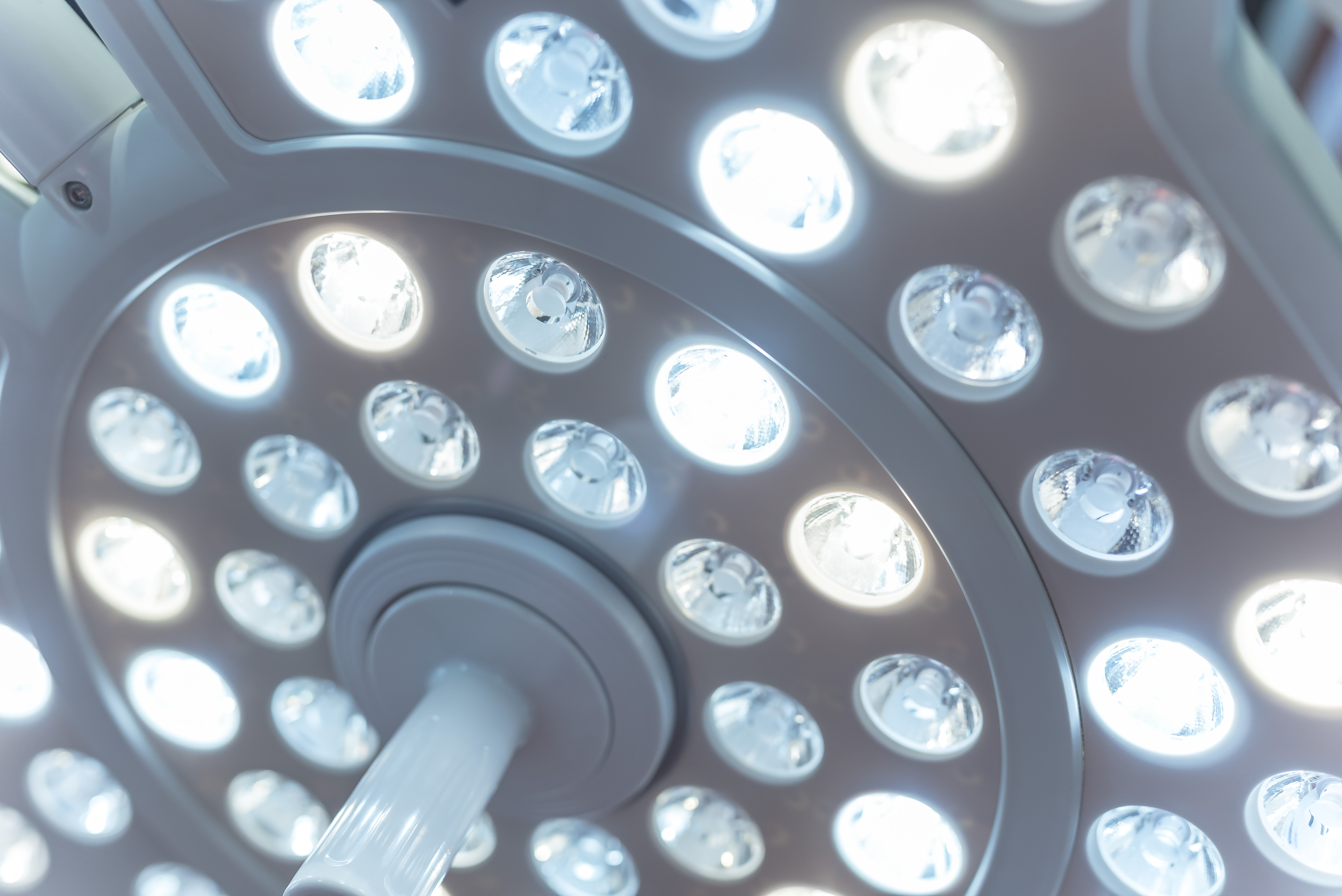 Closeup of a high-end LED Surgical light with multiple bulbs for an operating room. An Operation theatre light medical device. Closeup of a high-end LED Surgical light with multiple bulbs for an operating room. An Operation theatre light medical device.
