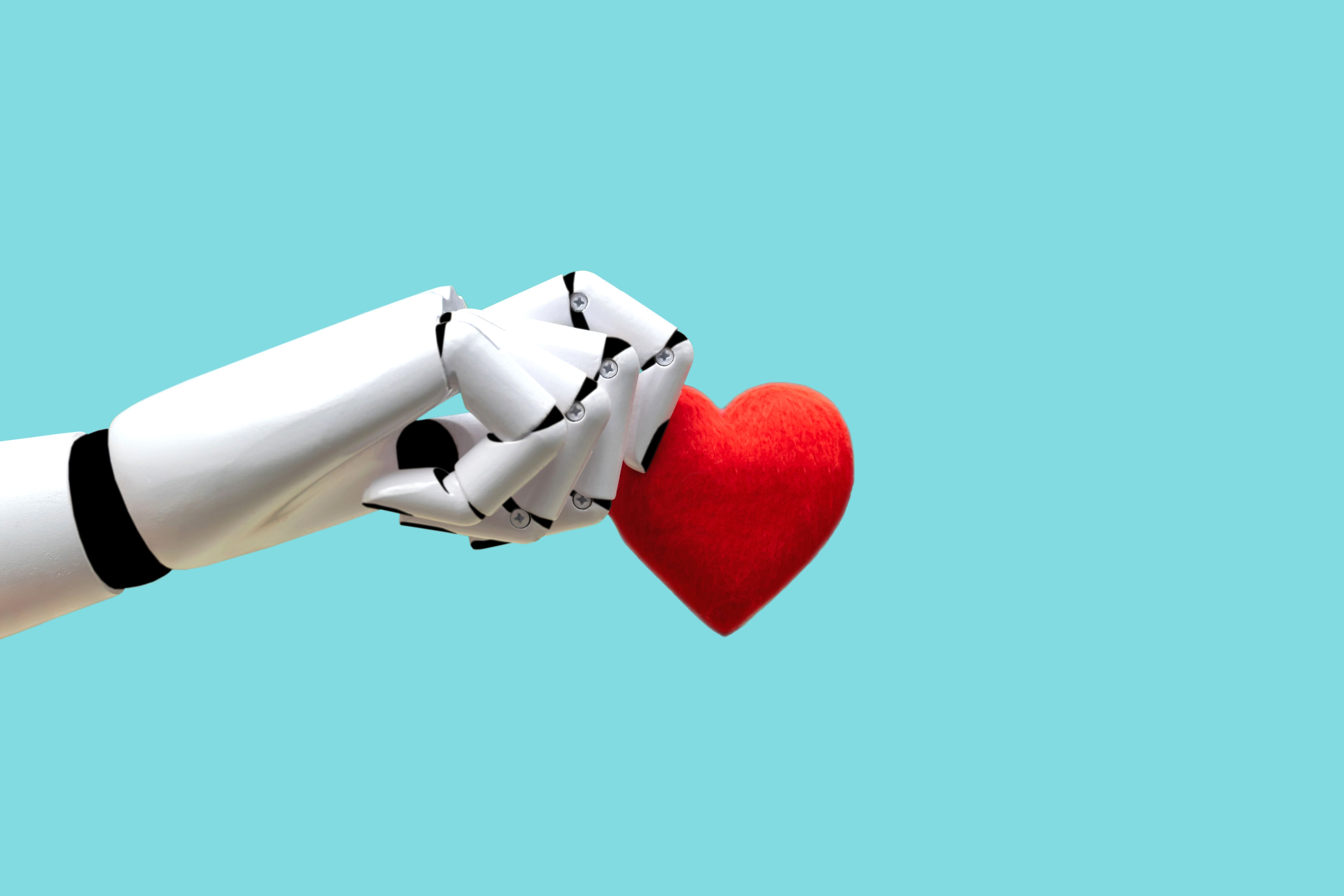 Robot hand holding heart Medical Technology Future Power