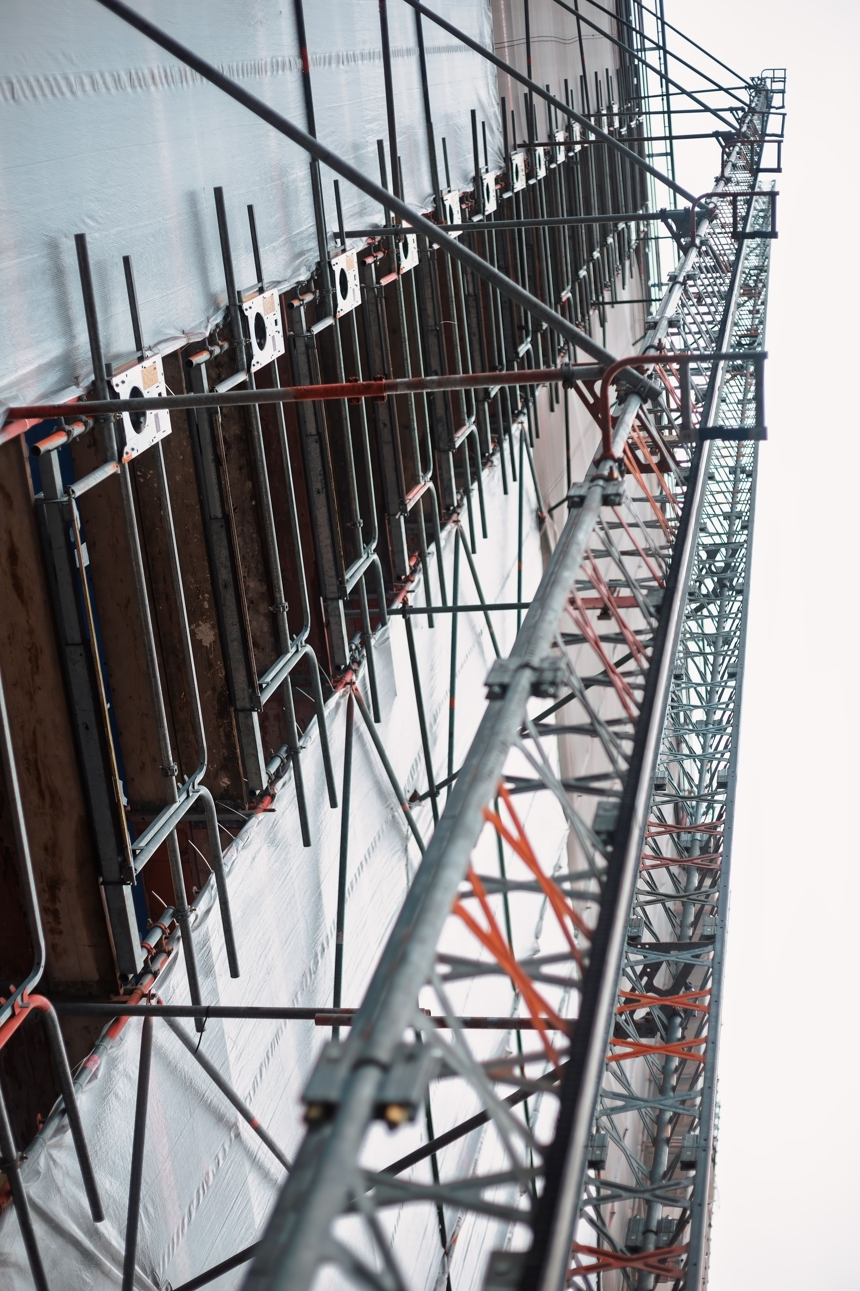 Scaffolding and concrete formwork supporting a new building under construction