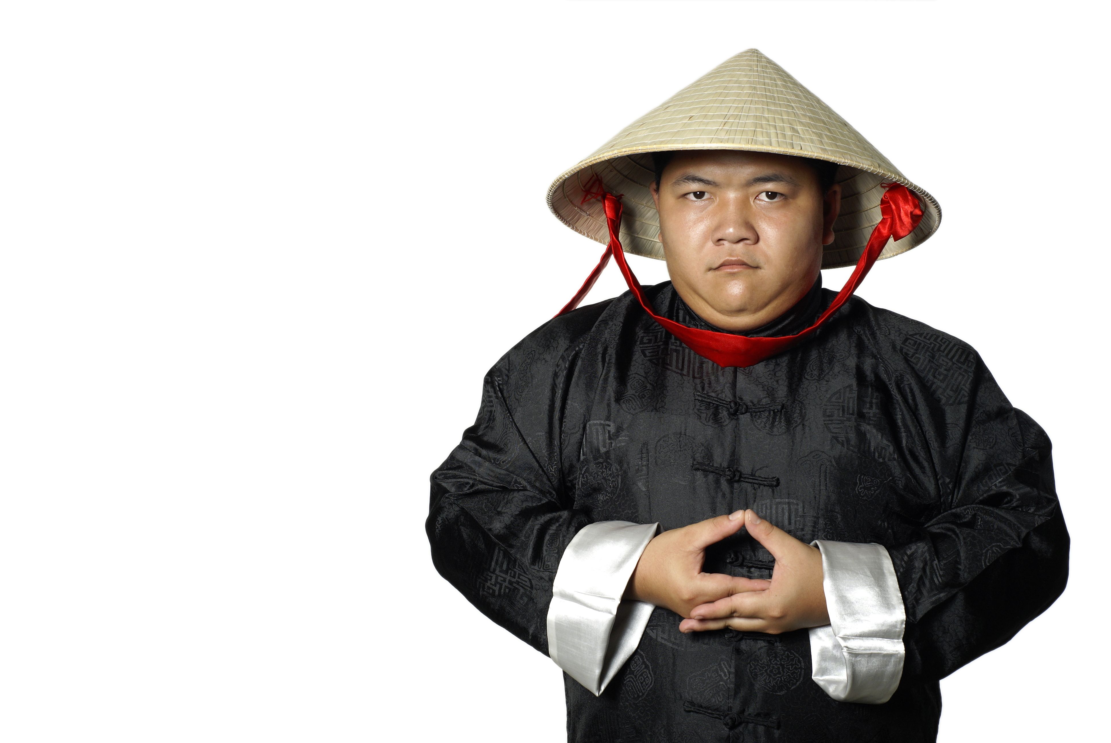 Asian man in traditional chinese costume meditating