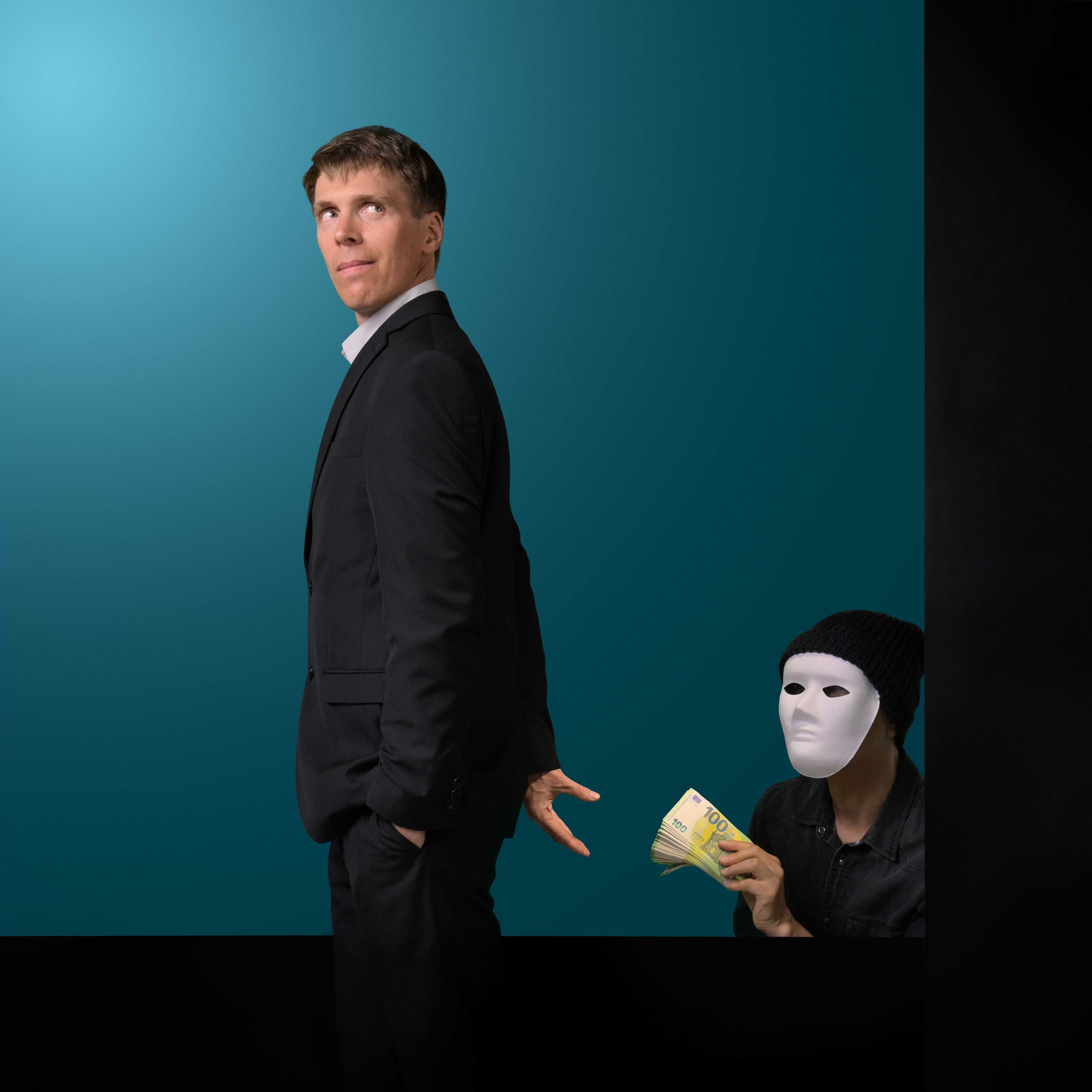 Corrupt businessman receiving bribe money from masked man Corrupt businessman receiving bribe money from masked man