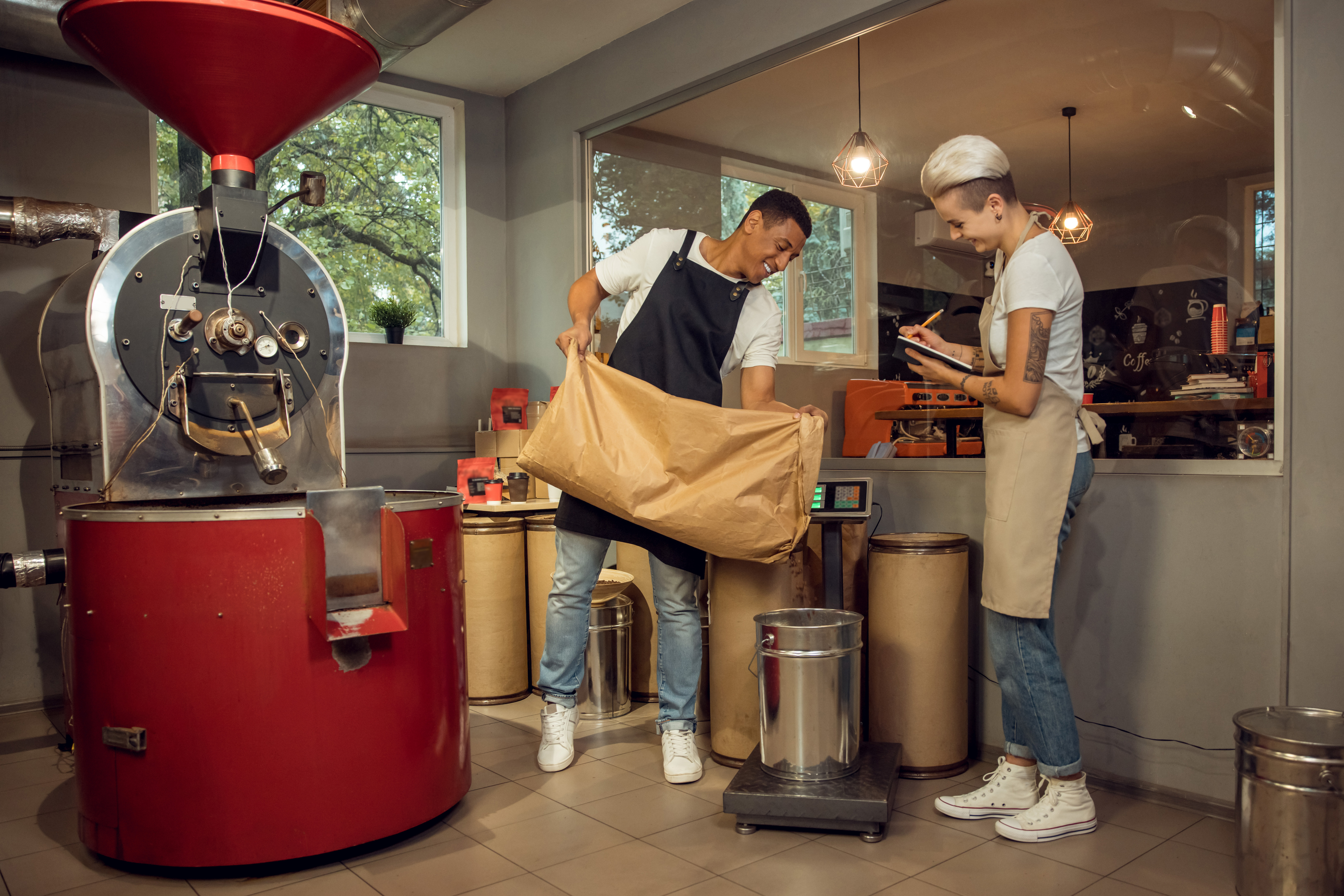 Staff measuring the product weight on the platform scales