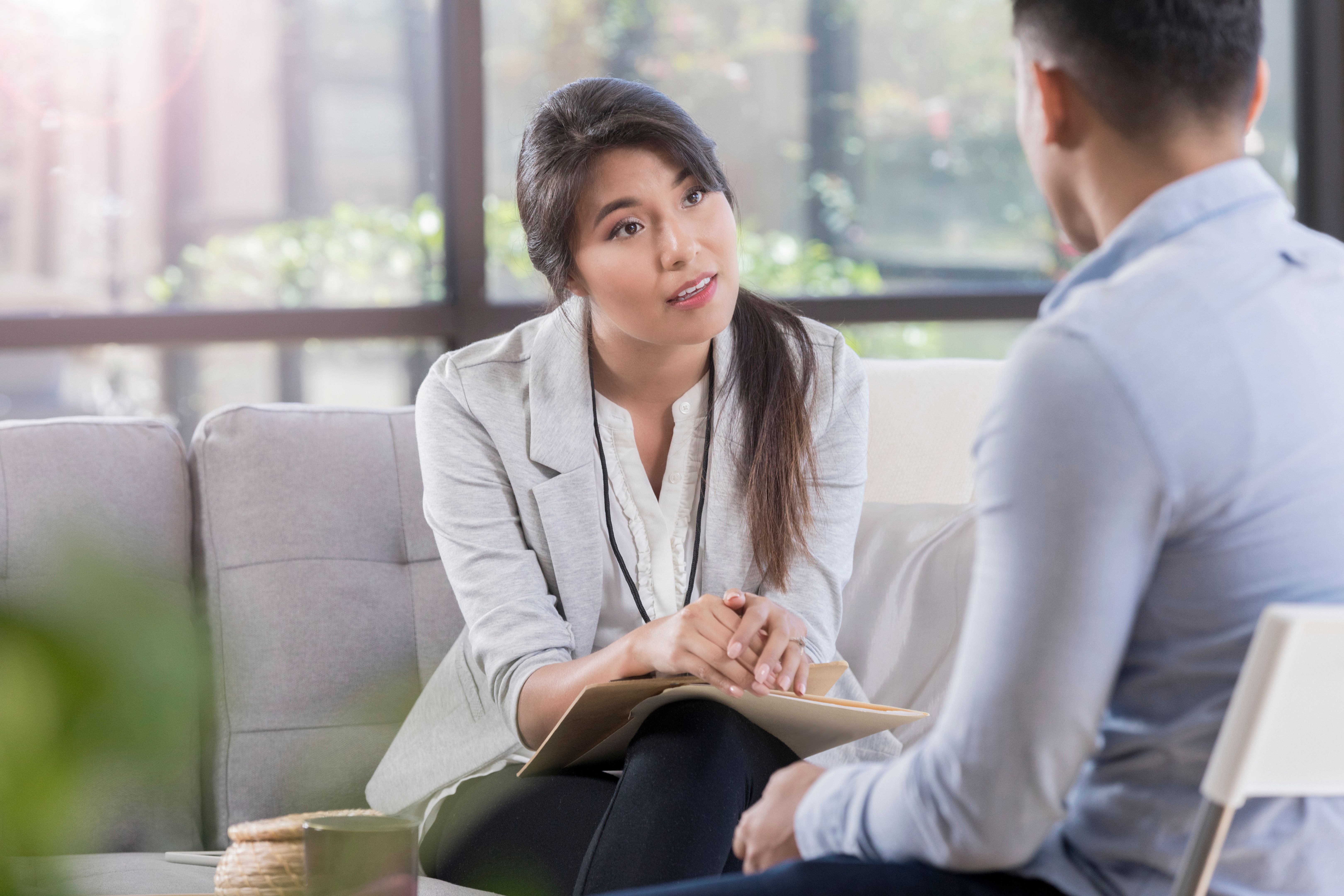 Mental health professional listens intently to patient
