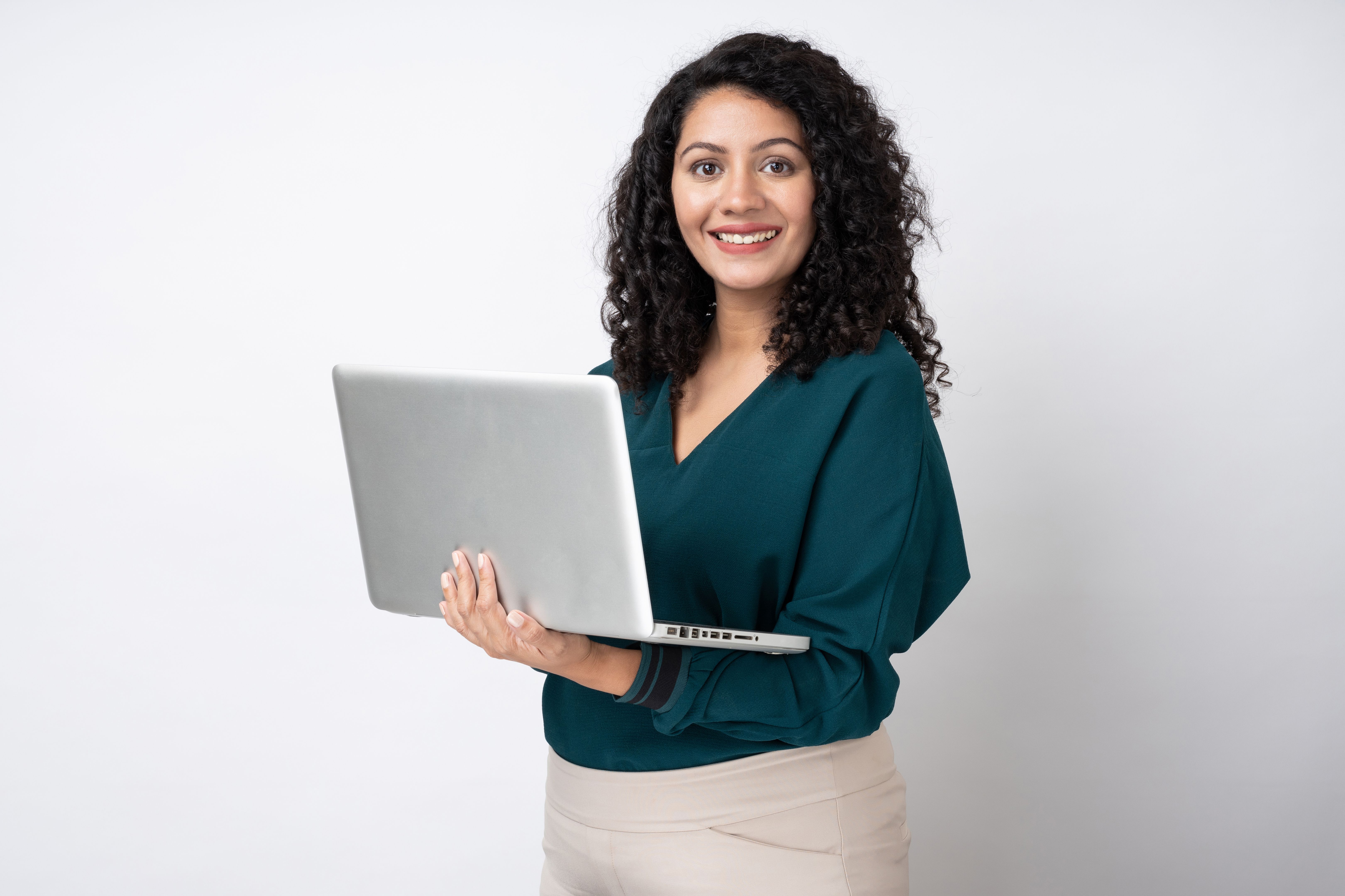 Portrait of young businesswoman with curly hairstyle wear trendy smart casual outfit isolated on white background stock photo