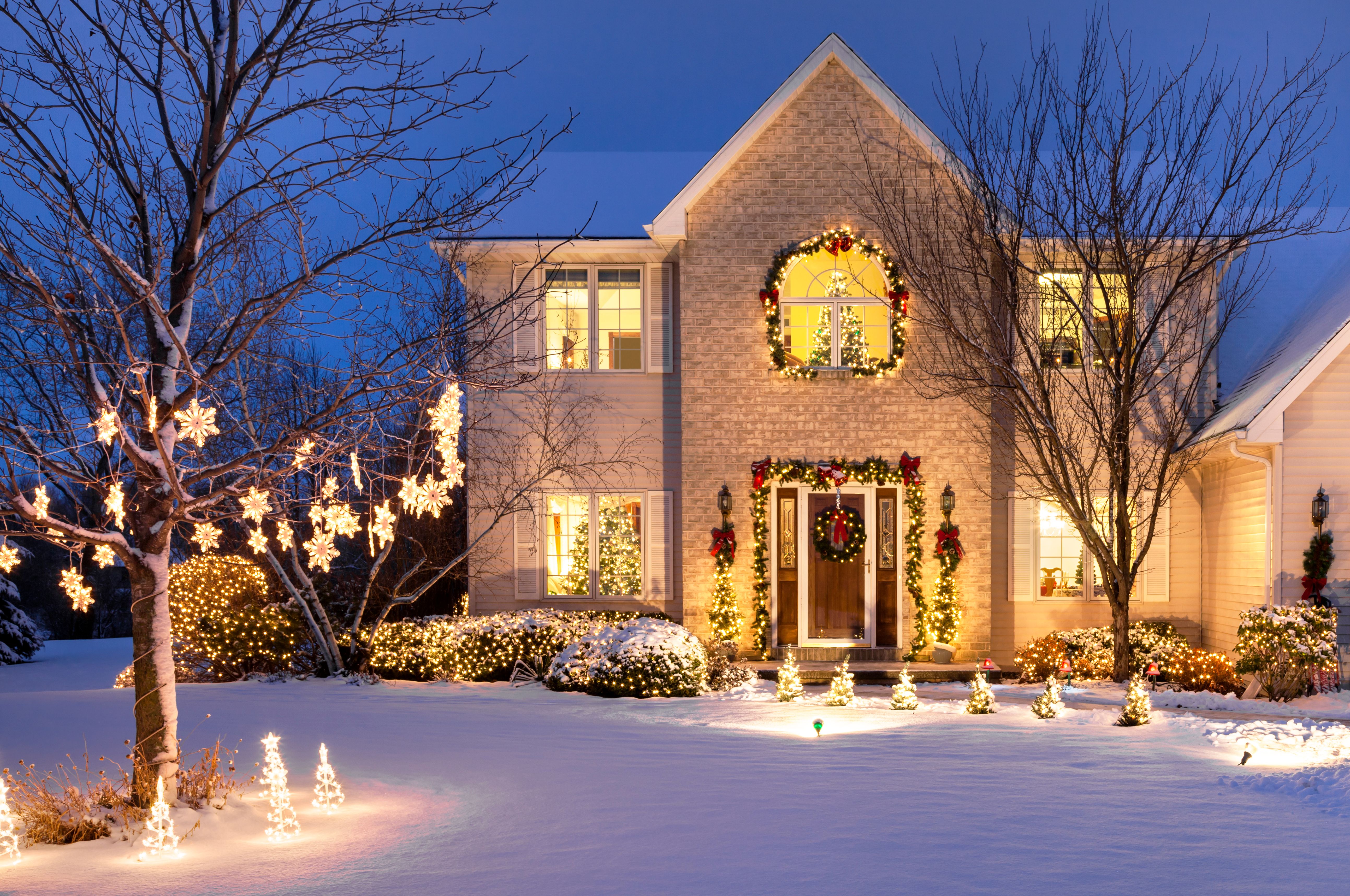 Home With Festive Christmas Lighting and Snow