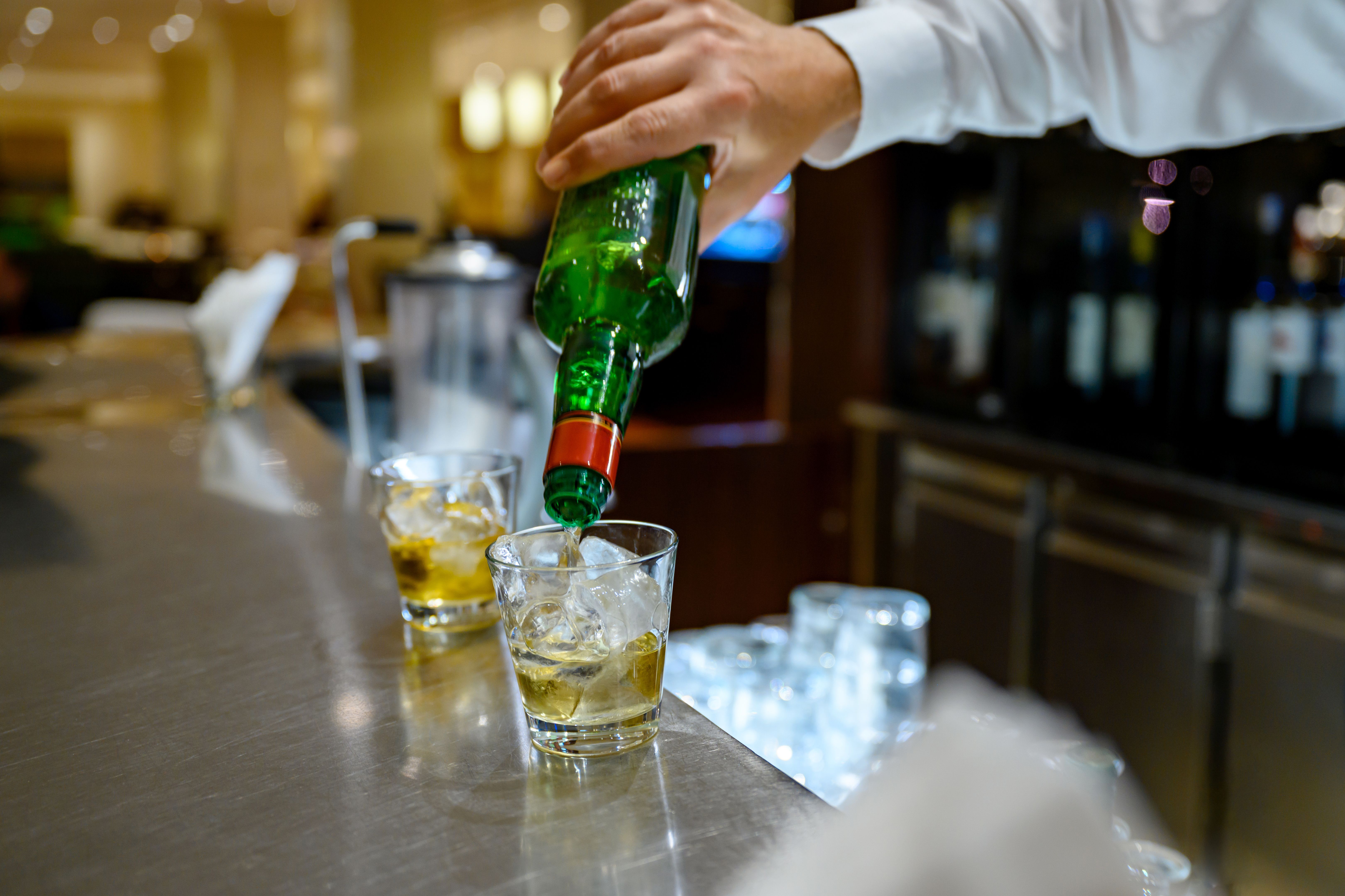 Bartender pouring whiskey