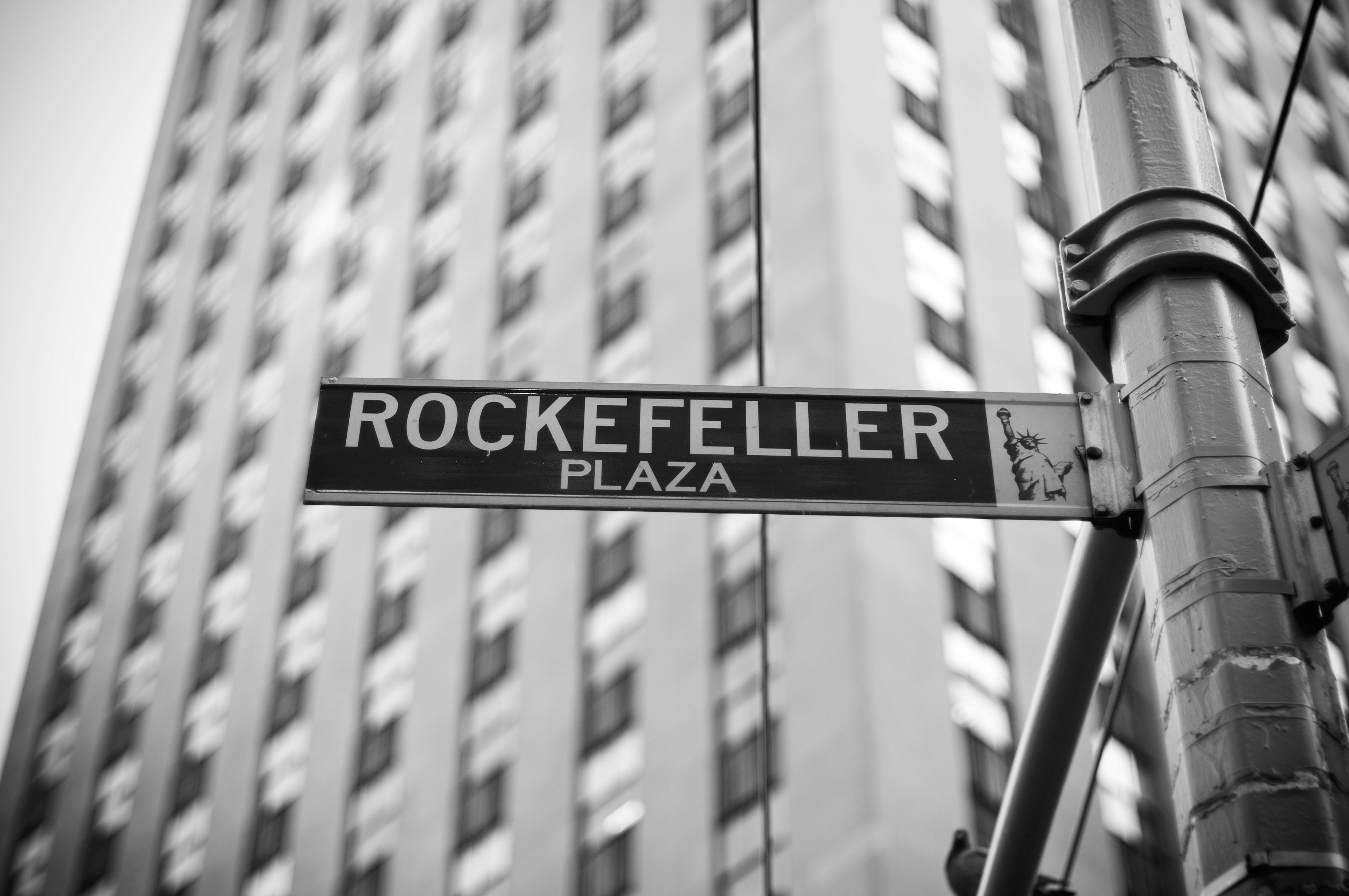 Close-up photo of the Rockefeller Plaza street sign