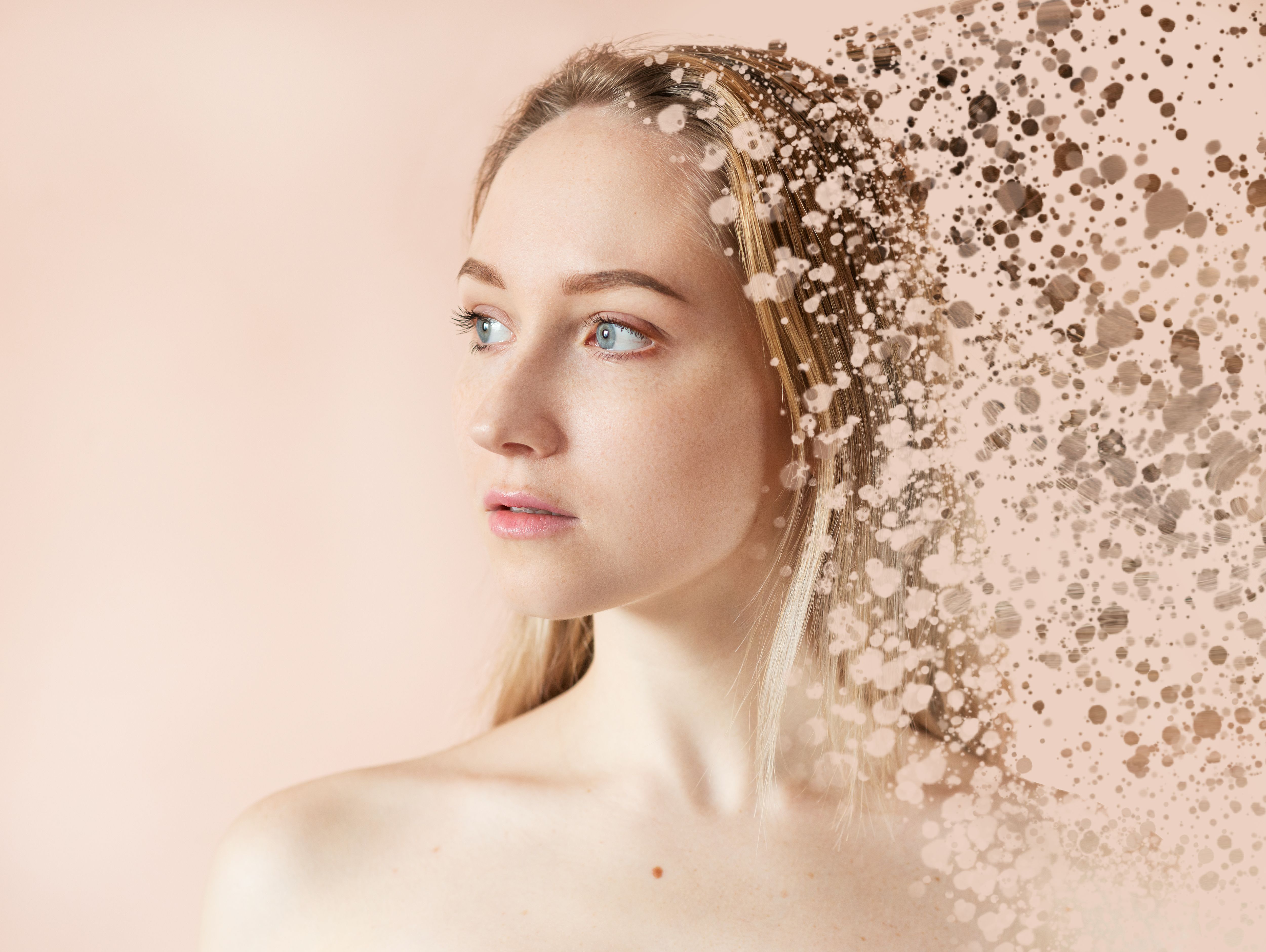 Woman face disintegrates.
