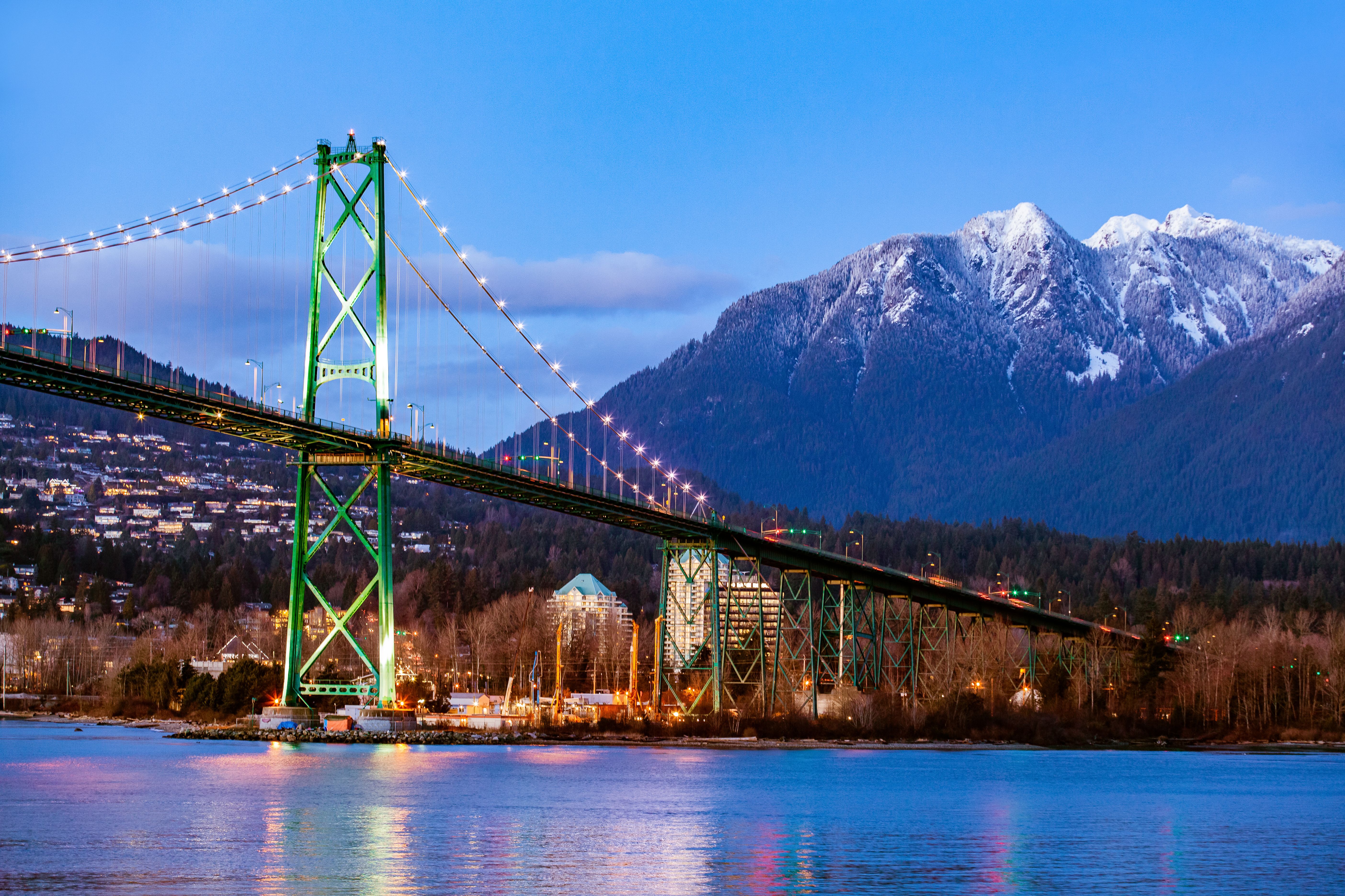 Lion's Gate Bridge and Grouse Mountain view at twilight Lion's Gate Bridge and Grouse Mountain view at twilight