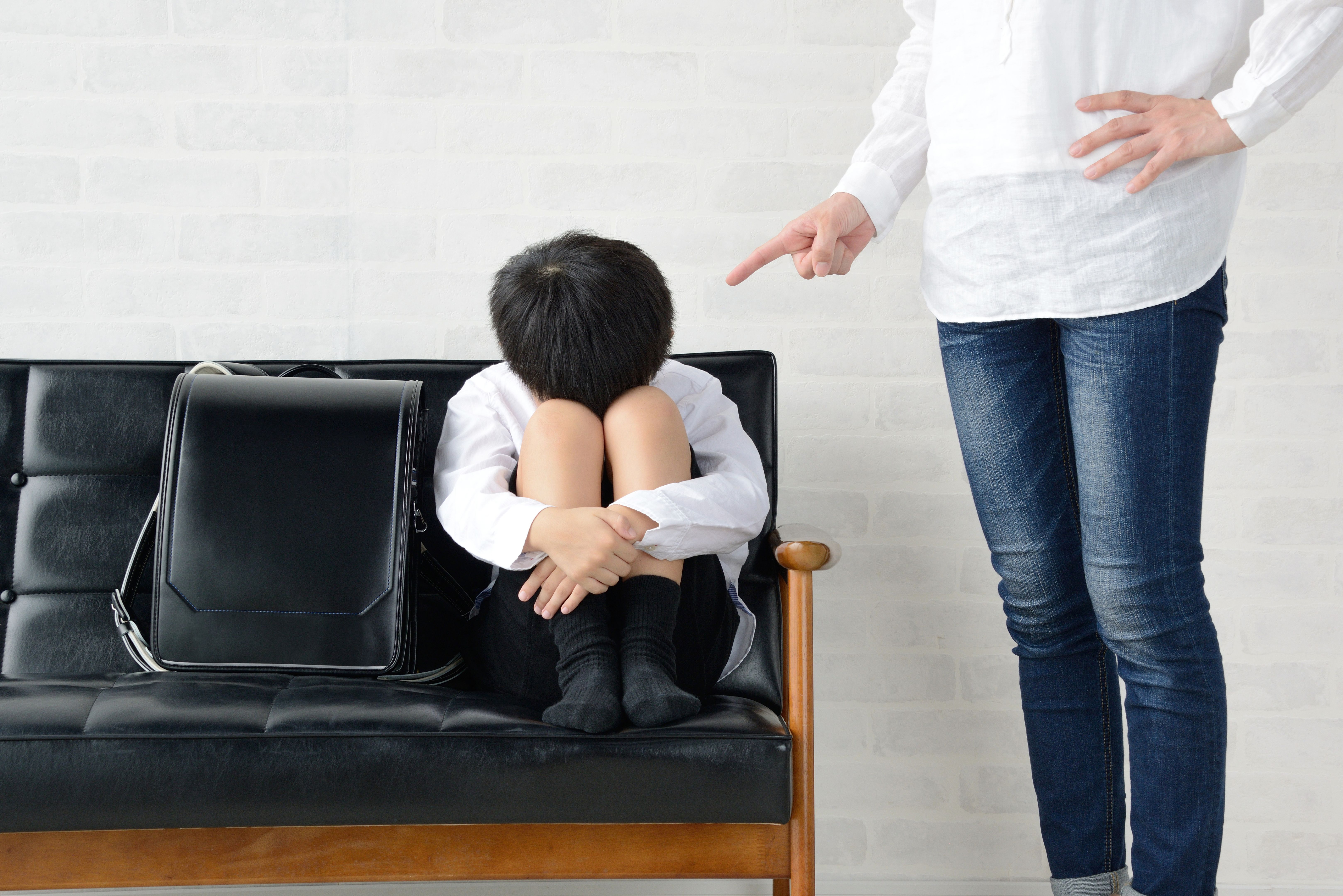 Mother scolding her son