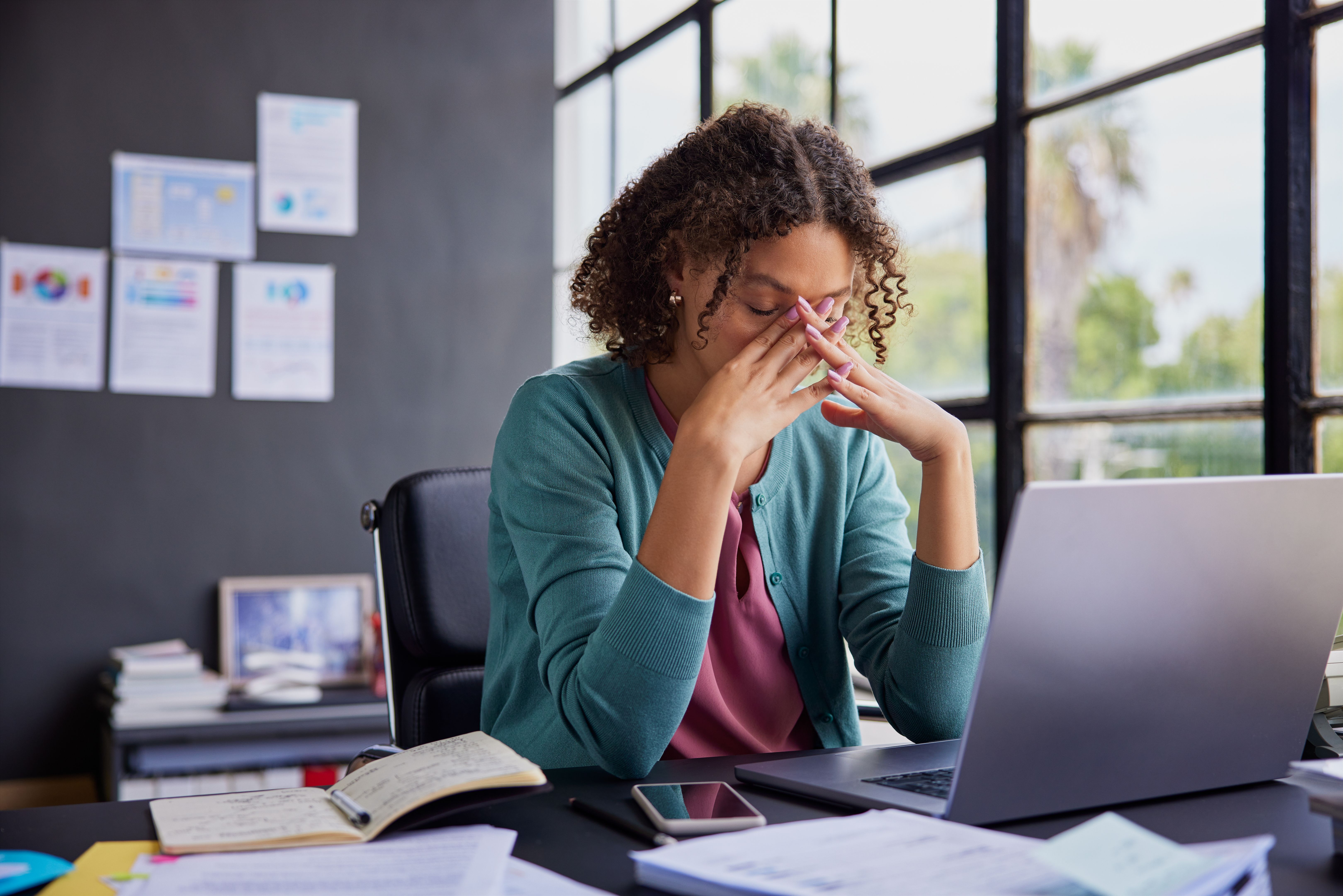 Stressed multiethnic businesswoman at work Stressed multiethnic businesswoman at work