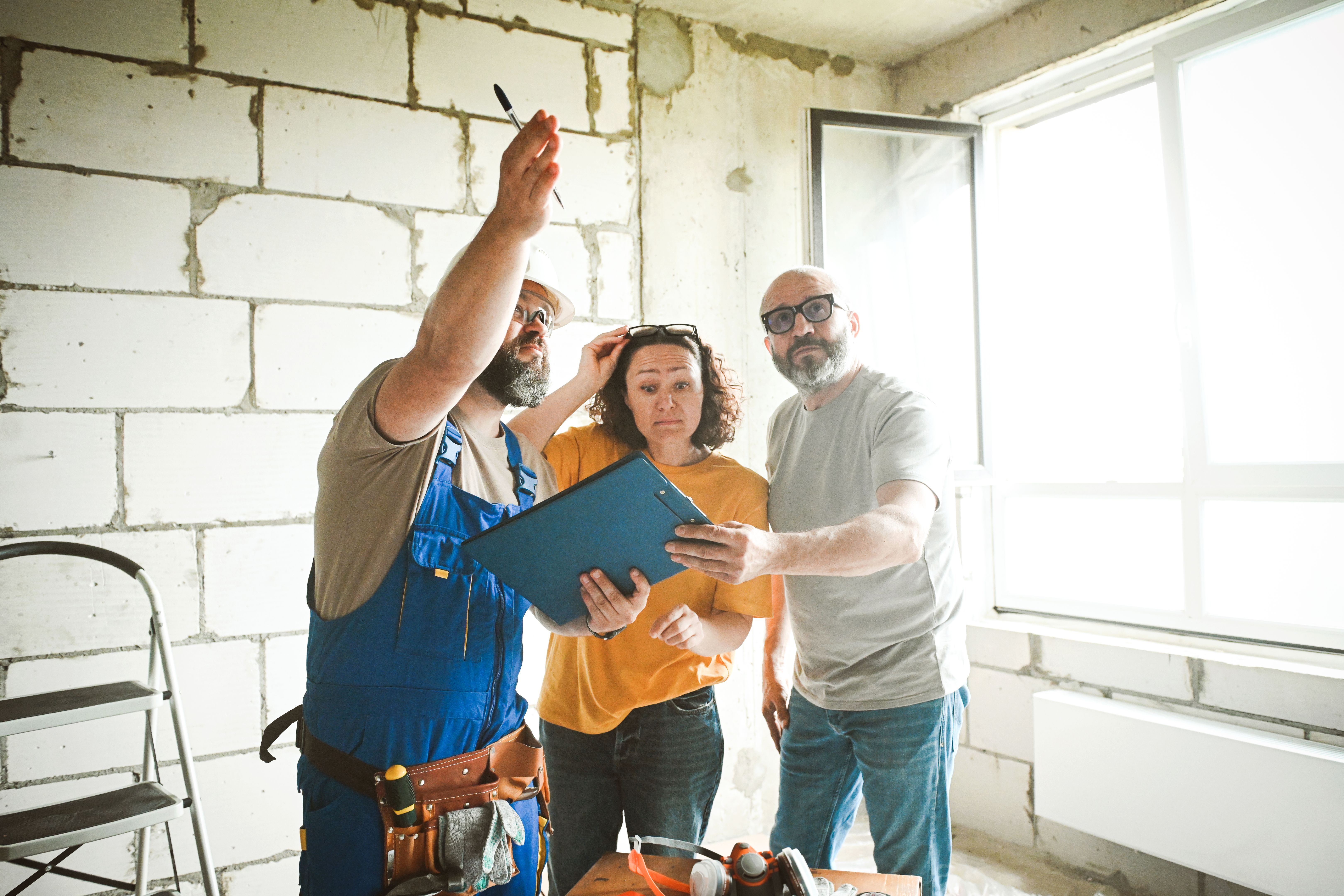 workers are doing repairs in the apartment