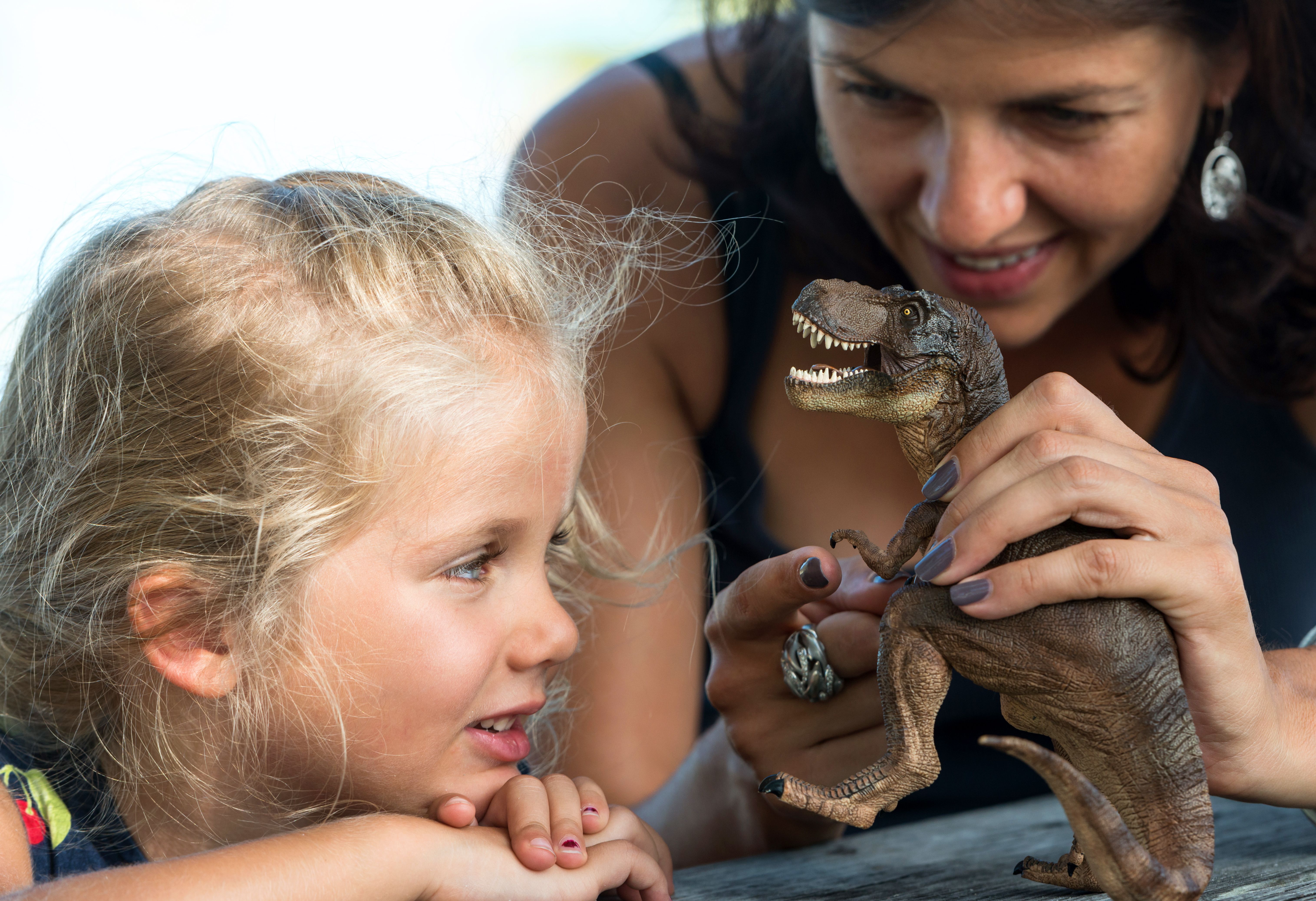 family exploring dinosaurs